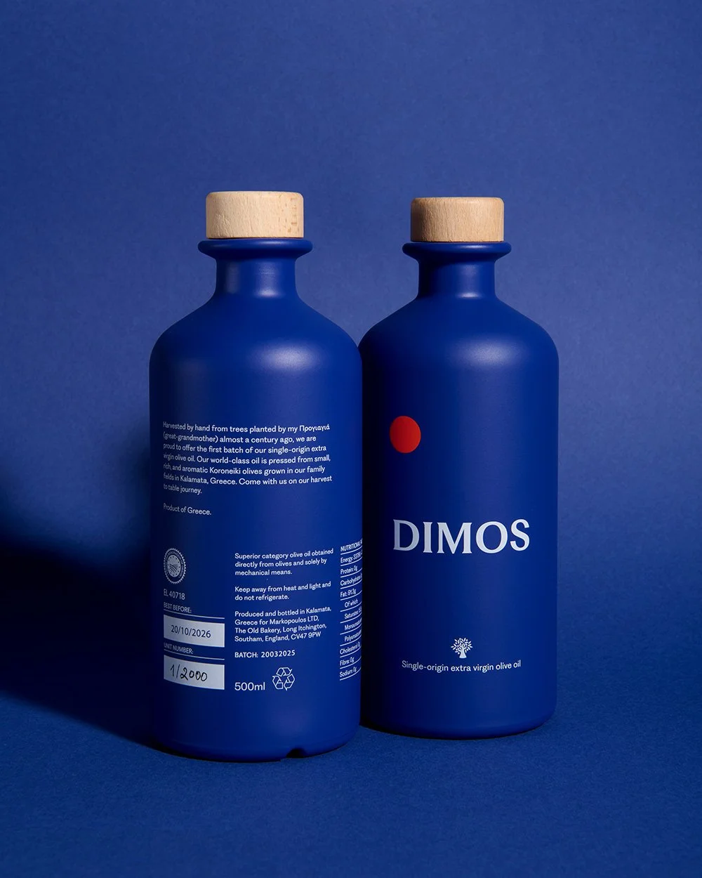 DIMOS olive oil bottles on a blue background.