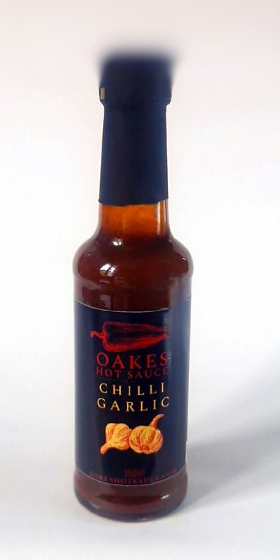 Oakes Chilli Garlic Hot Sauce bottle on a plain white background.