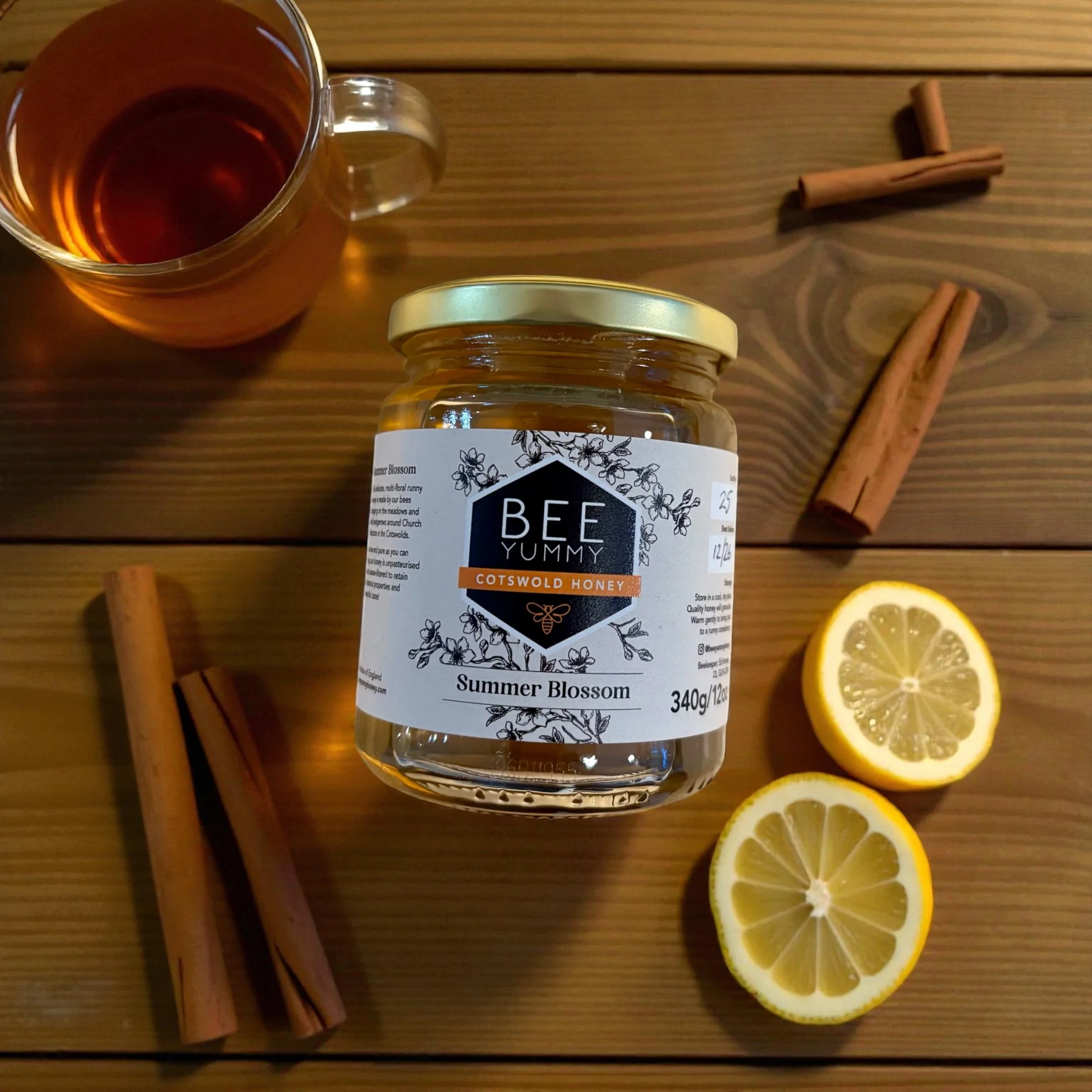 Bee Yummy Summer Blossom Cotswold Honey jar with tea, cinnamon and lemon.