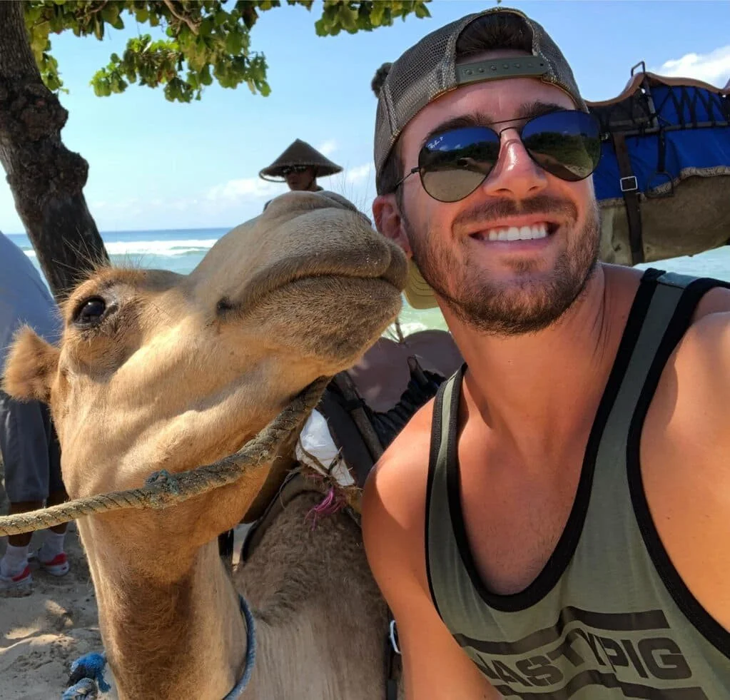 Male posing with camel.jpg