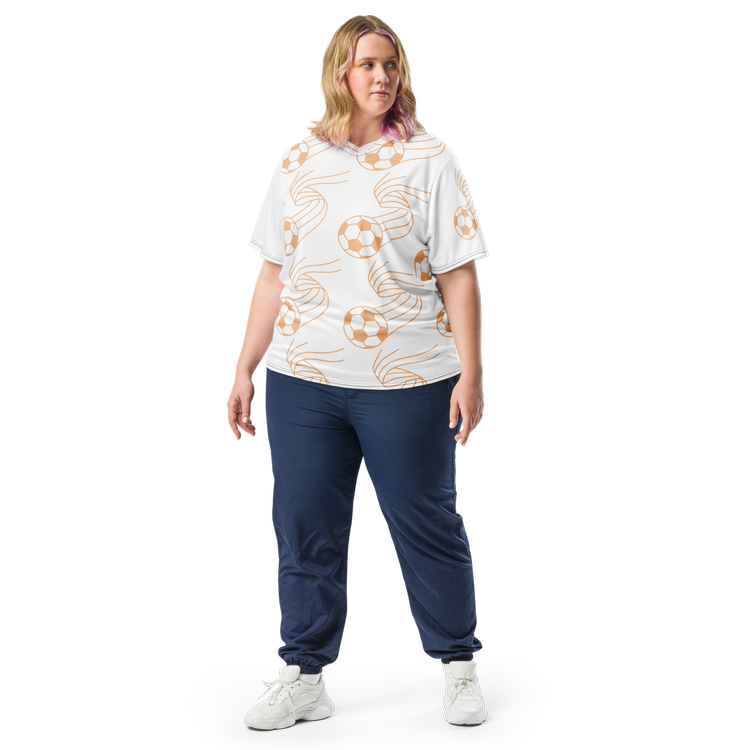 Person wearing a white soccer-themed shirt and blue pants. The casual statement of a soccer fan in favorite custom apparel with all-over-print design.