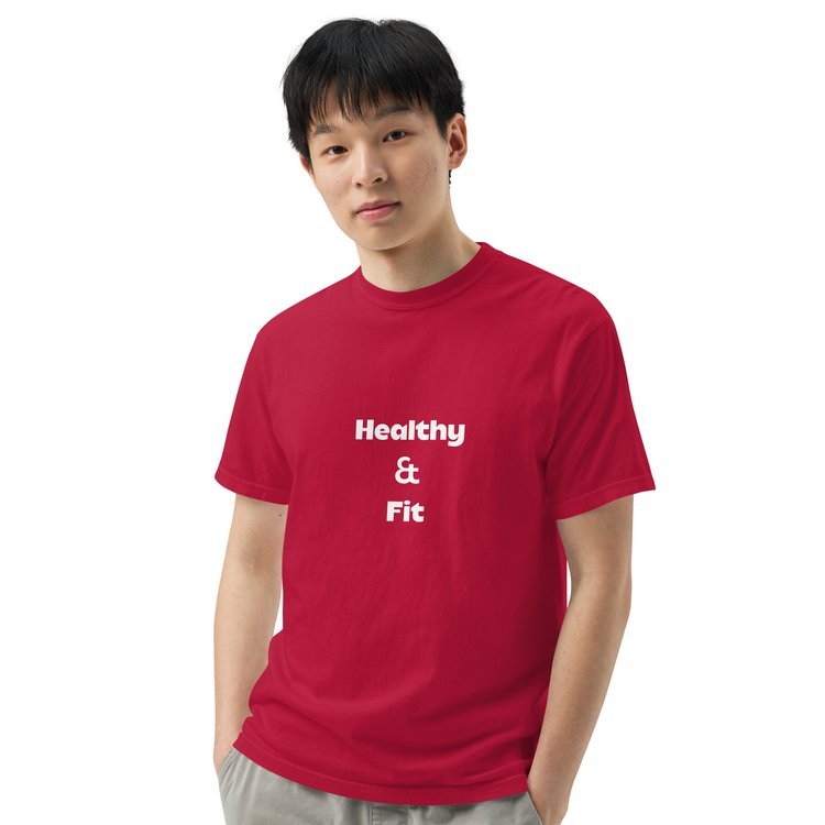 Person wearing a red T-shirt with the text 'Healthy & Fit' printed in white. A reminder to stay healthy while inspiring others.