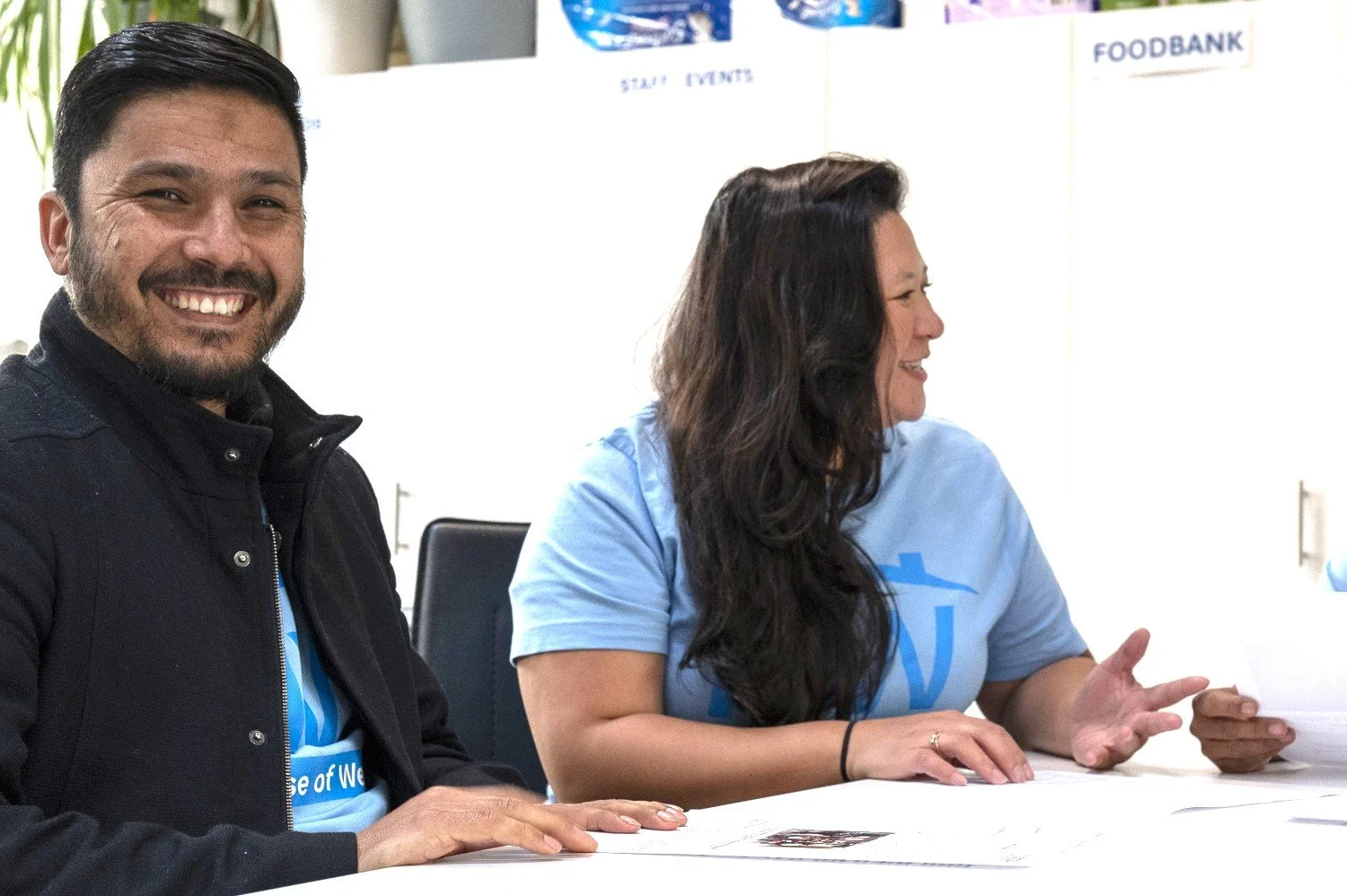 Sayed and Ruth smiling for the partnership photo for House of Welcome