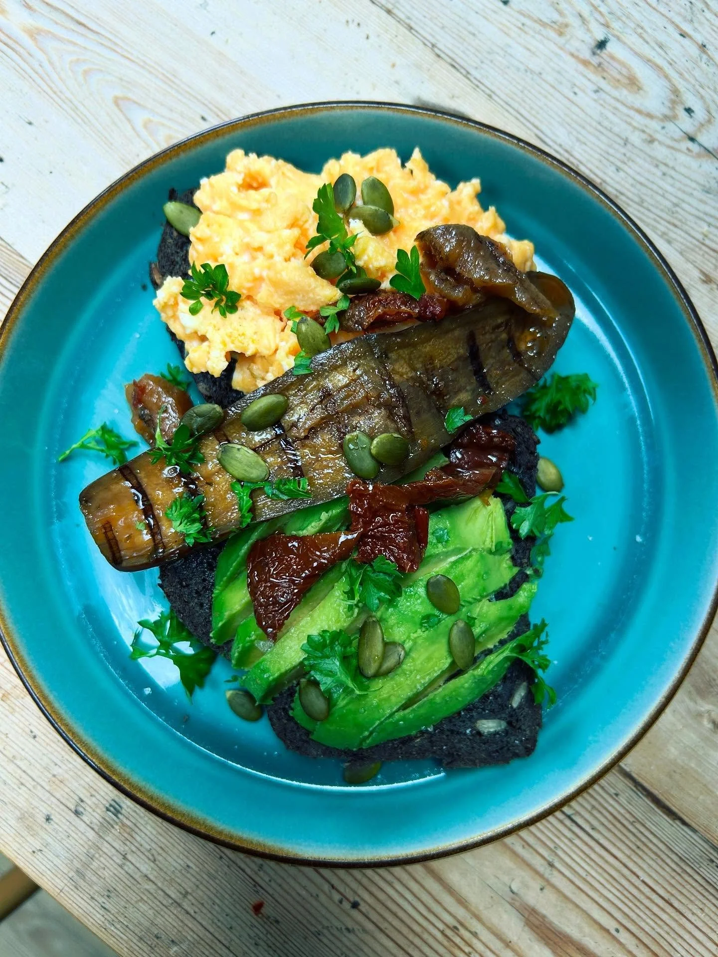 Weekend food inspiration - using the &ldquo;adding in&rdquo; method to create interest, flavour, and wonderful nutrition to standard scrambled eggs and avocado on toast. Here I&rsquo;ve added in a topping of pumpkin seeds, marinated veg (from a jar) 