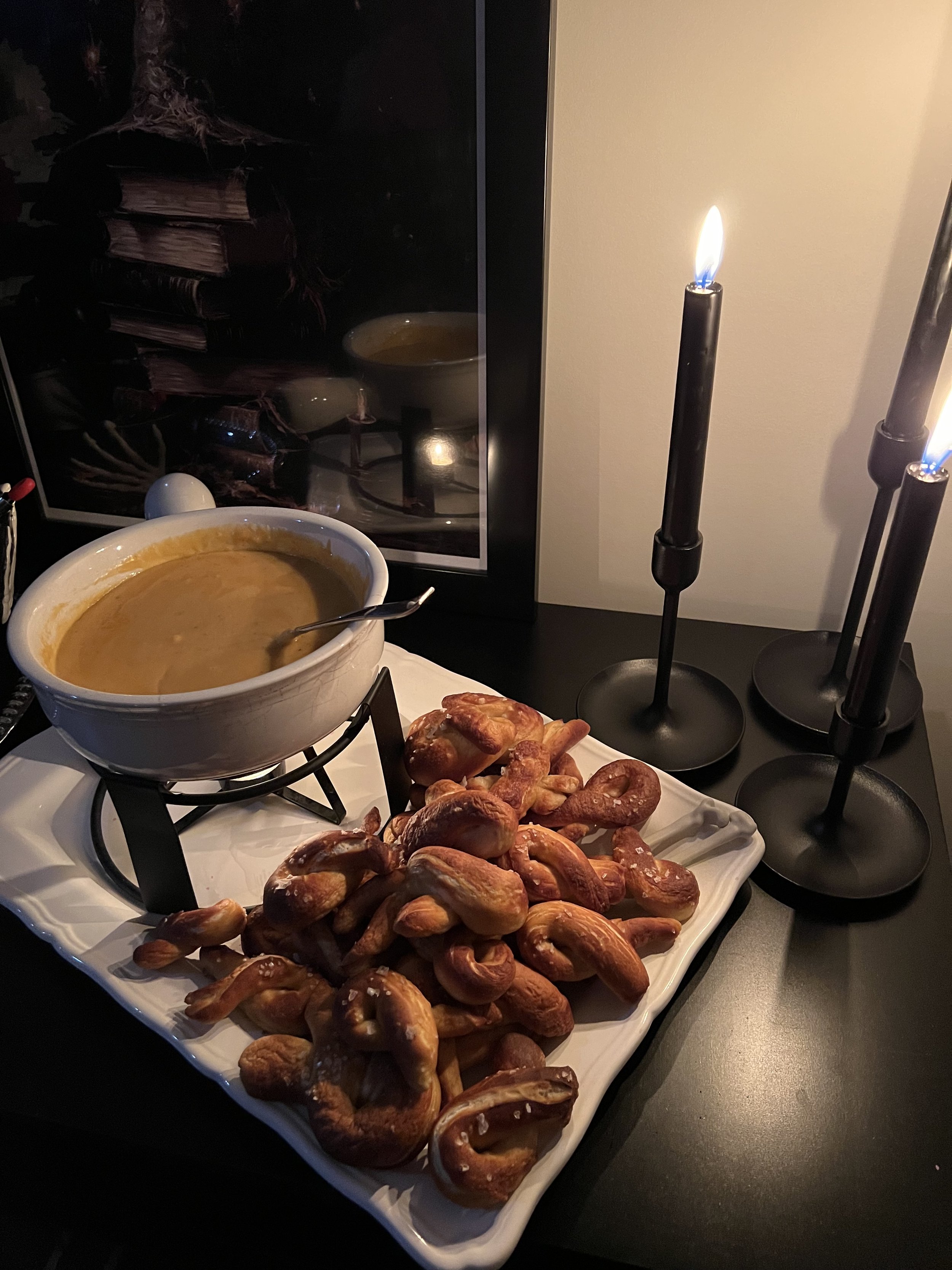 Warm, soft pretzels with a creamy beer cheese dip, perfect for a Halloween party.