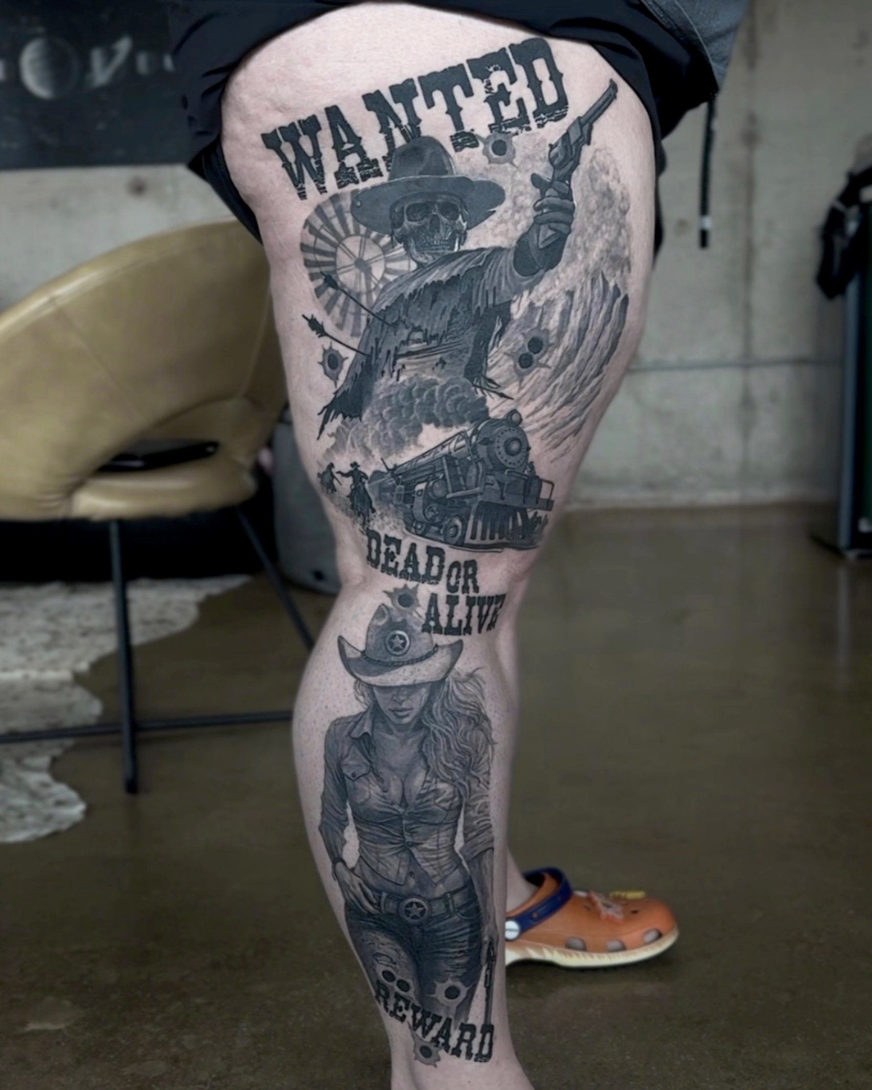 Healed wanted poster with cowboy and cowgirl realism tattoo on the leg by Etgar Oak