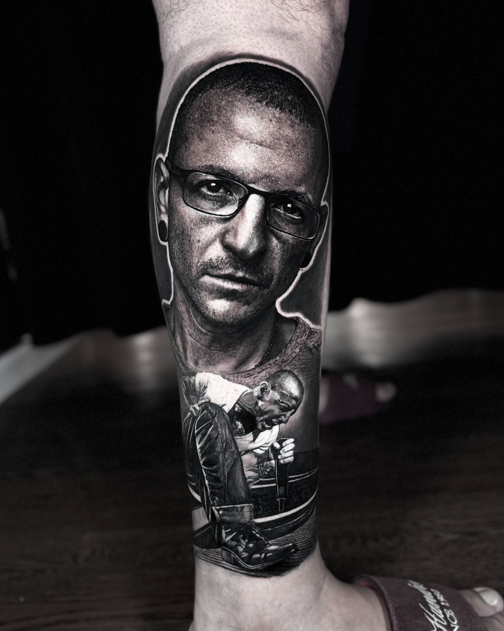 Man with glasses portrait realism tattoo on the calf by Etgar Oak