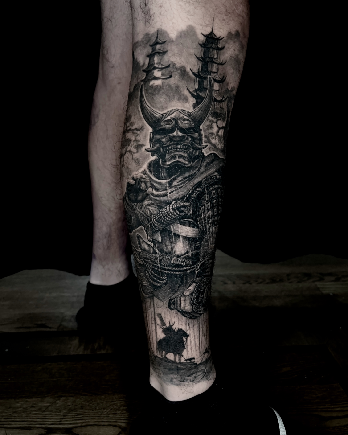 Samurai warrior and pagodas realism tattoo on the calf by Etgar Oak