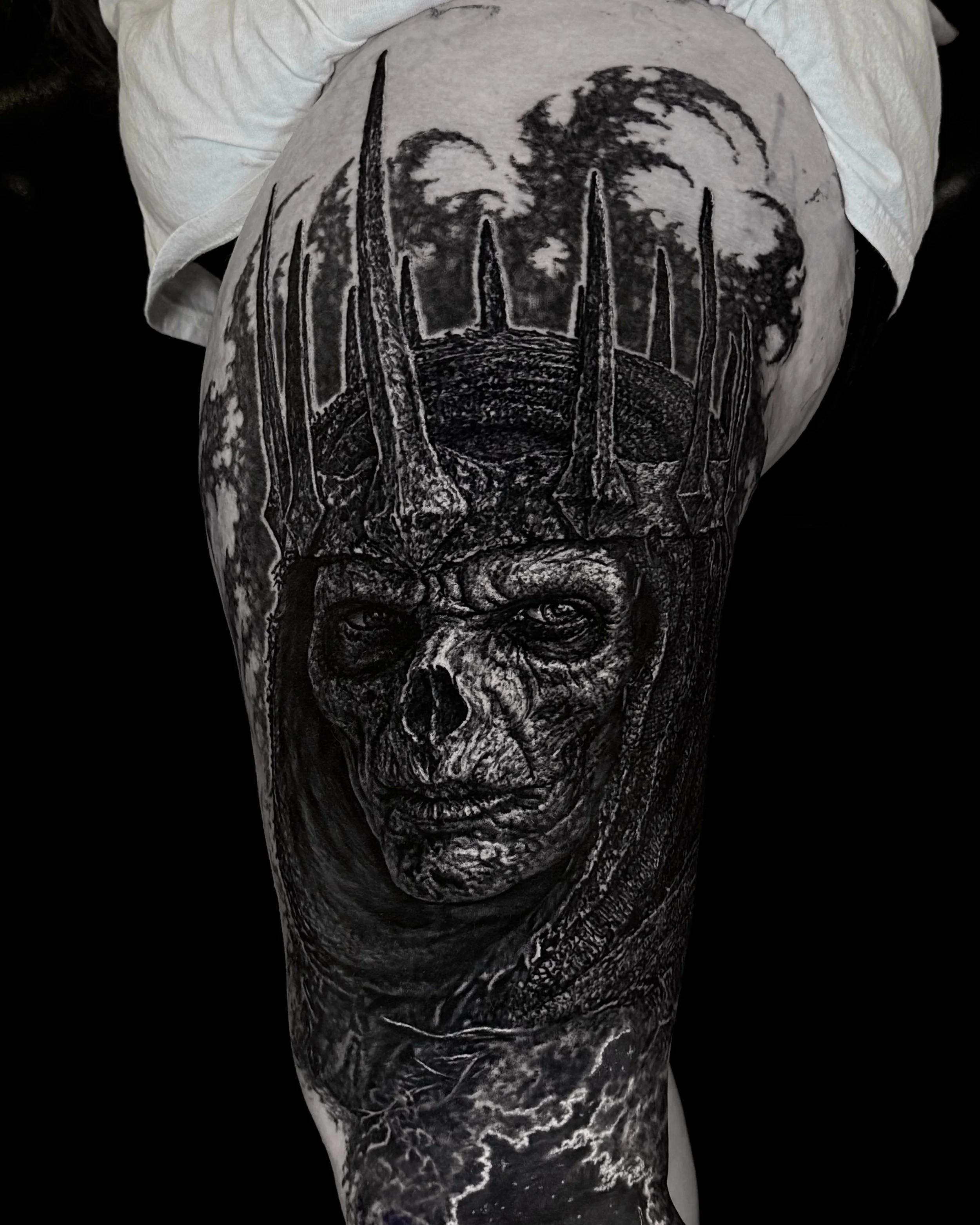 Undead king with spiked crown realism tattoo on the thigh by Etgar Oak