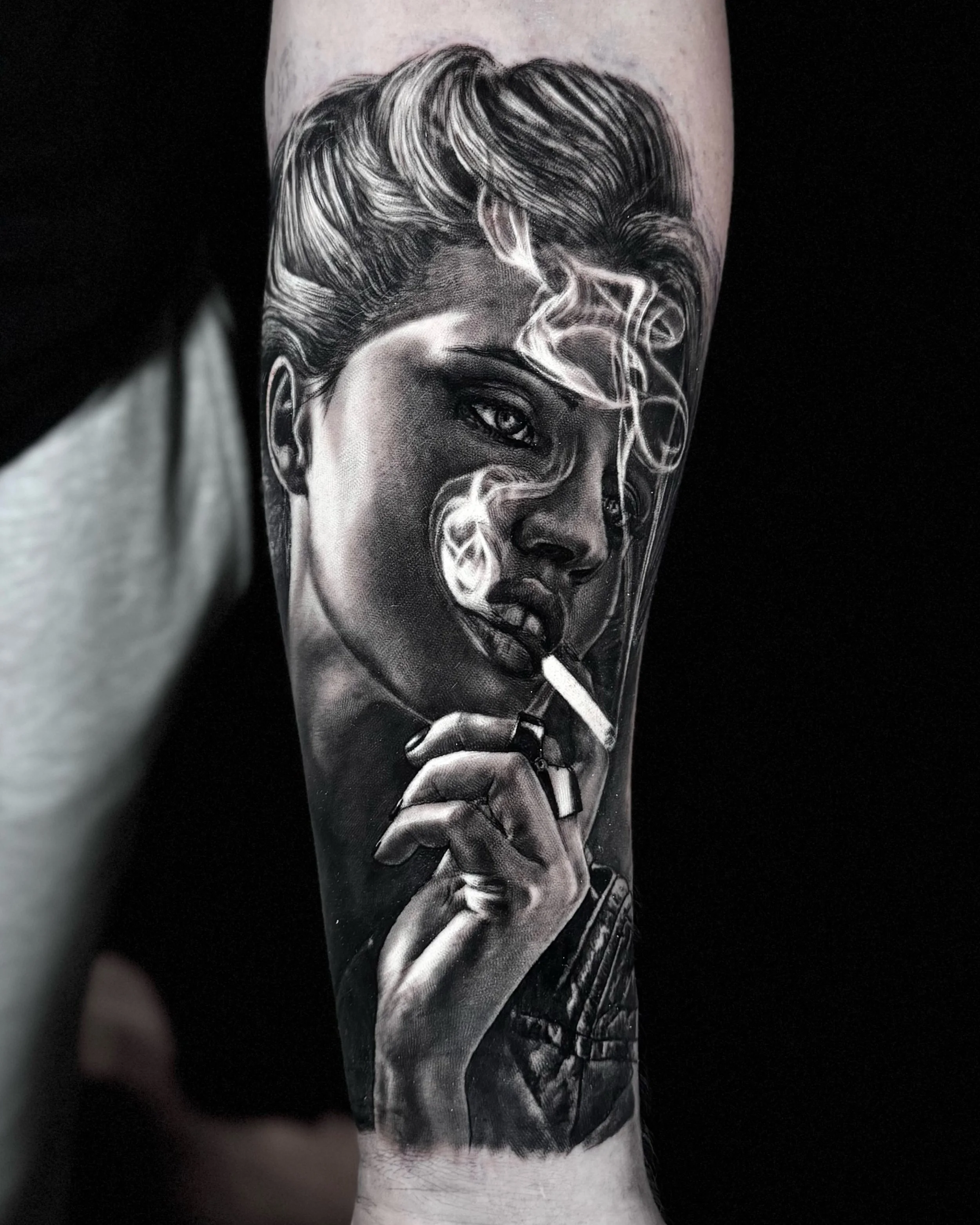 Woman smoking a cigarette portrait realism tattoo on the forearm by Etgar Oak