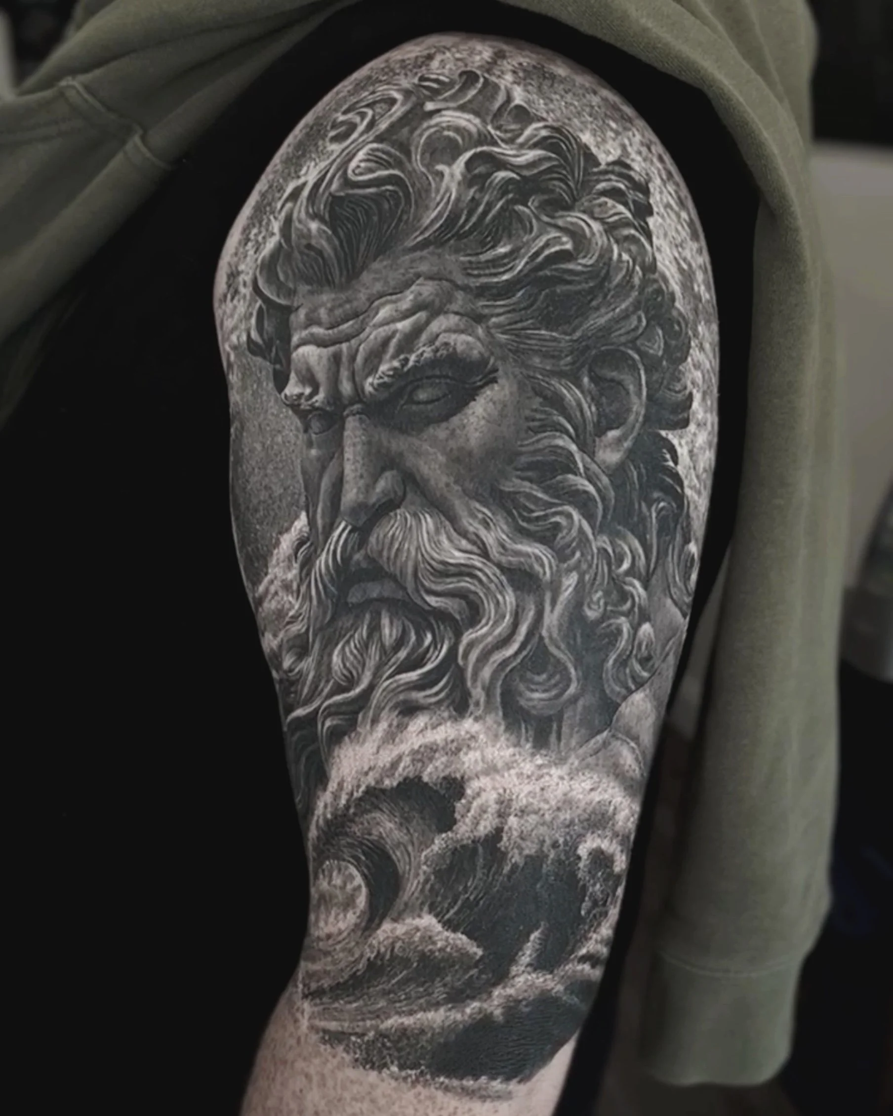 Healed Poseidon and waves realism tattoo on the upper arm by Etgar Oak