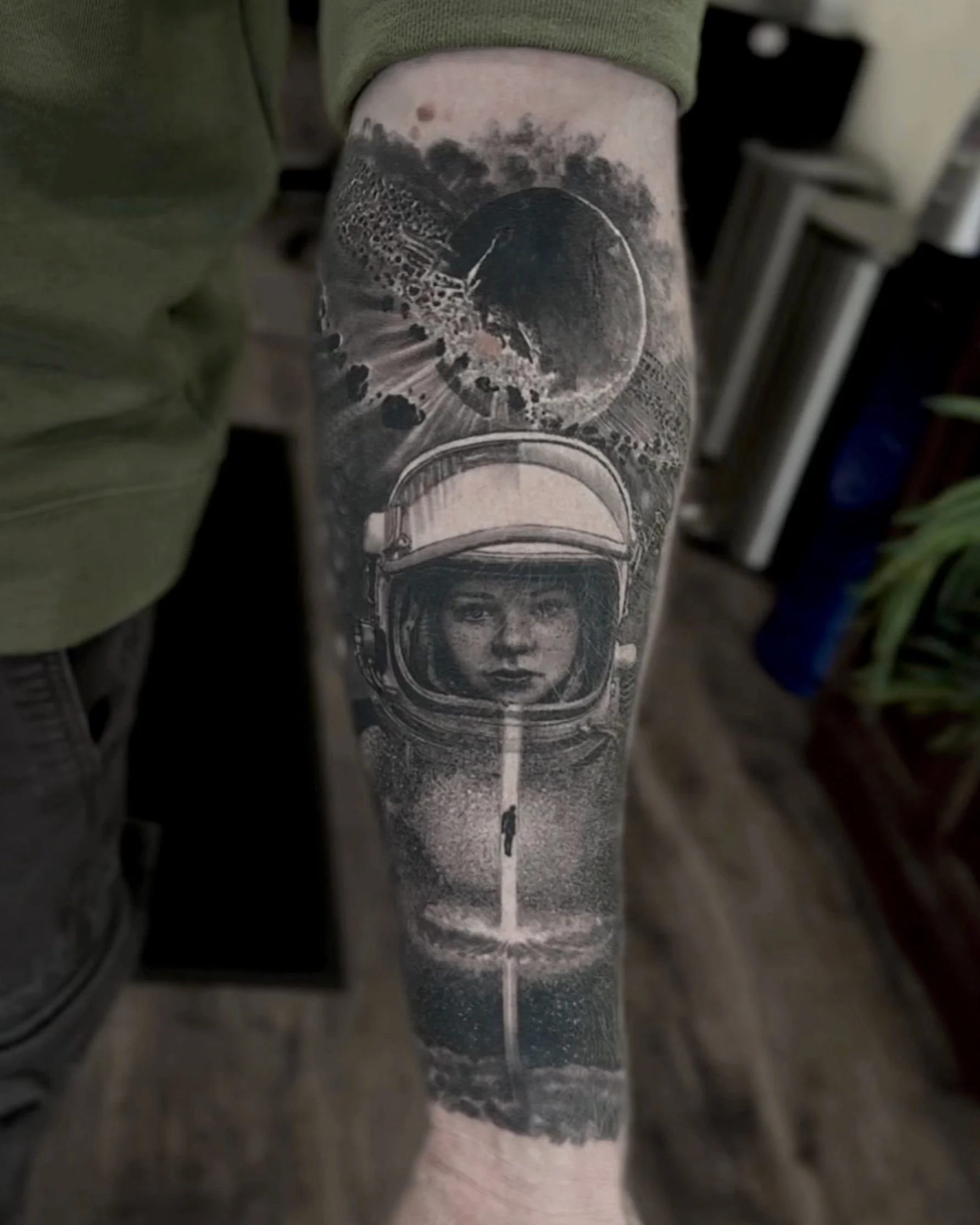 Healed astronaut woman and planet realism tattoo on the forearm by Etgar Oak