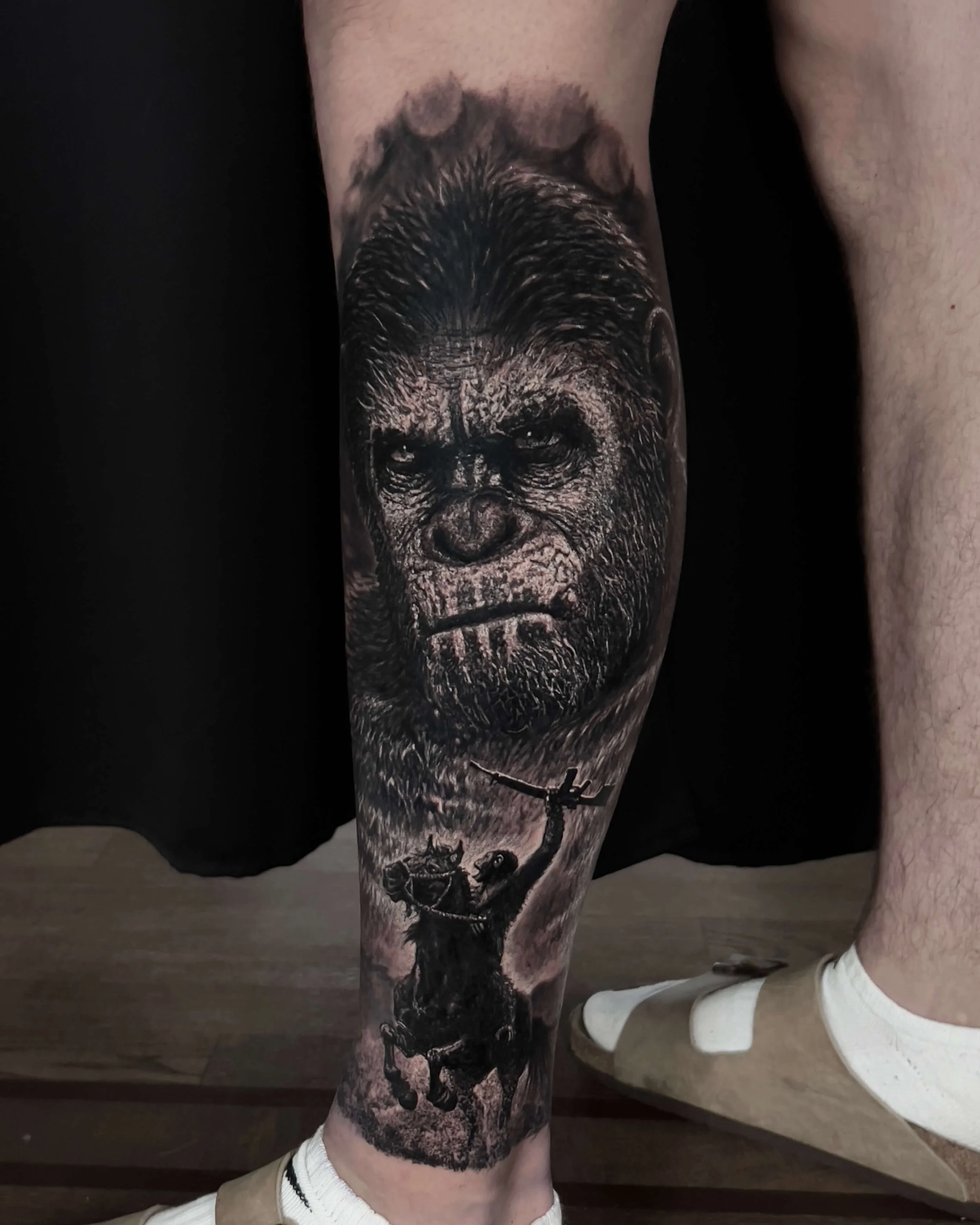 Ape face and horseback rider realism tattoo on the calf by Etgar Oak