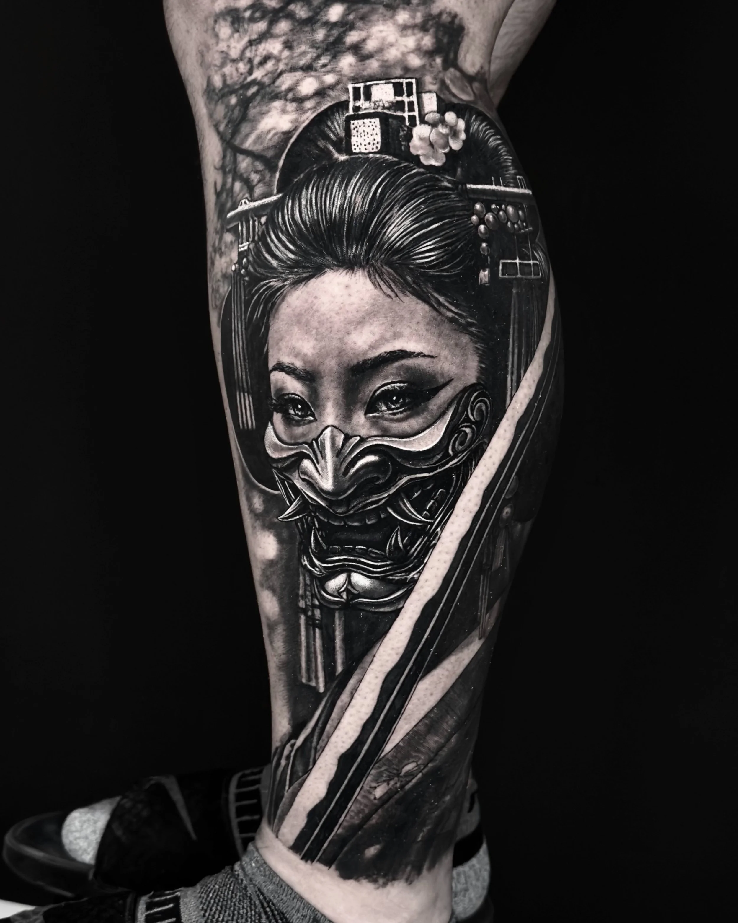 Geisha with oni mask and katana realism tattoo on the lower leg by Etgar Oak
