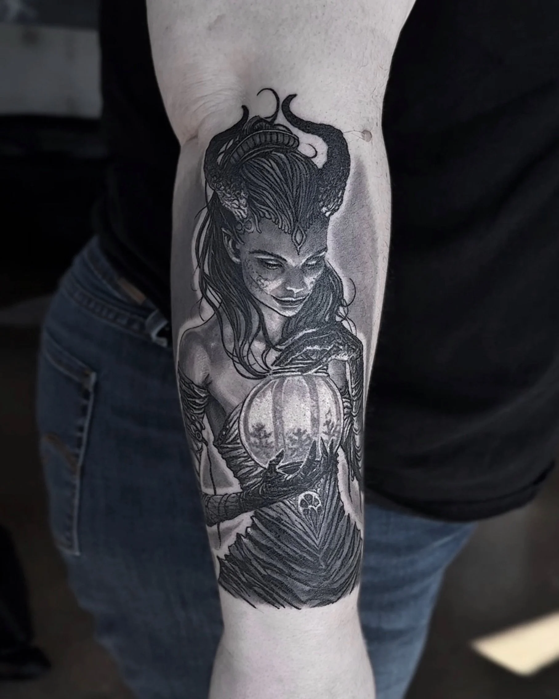Healed horned demon woman with lantern realism tattoo on the forearm by Etgar Oak