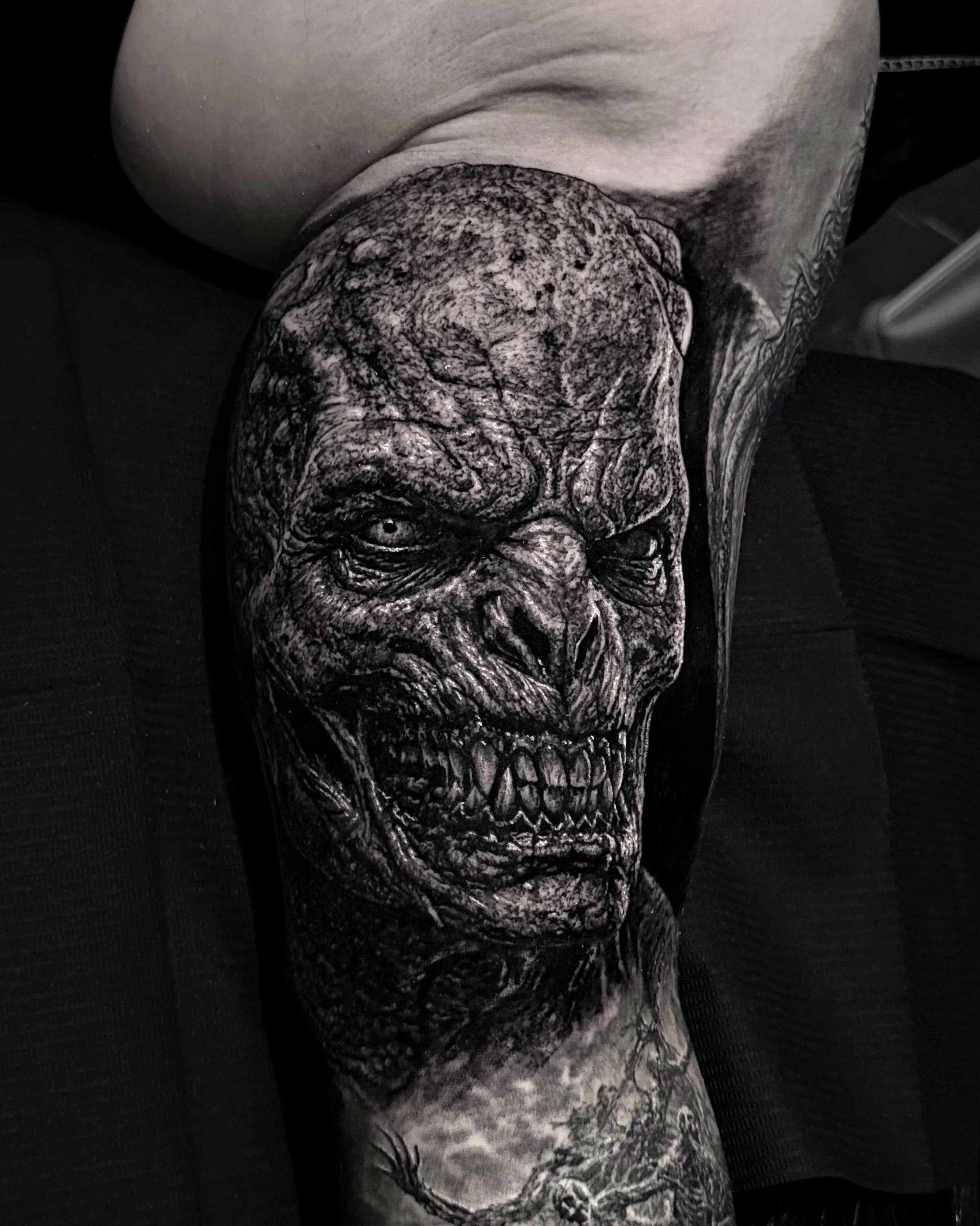 Monster face realism tattoo by Etgar Oak