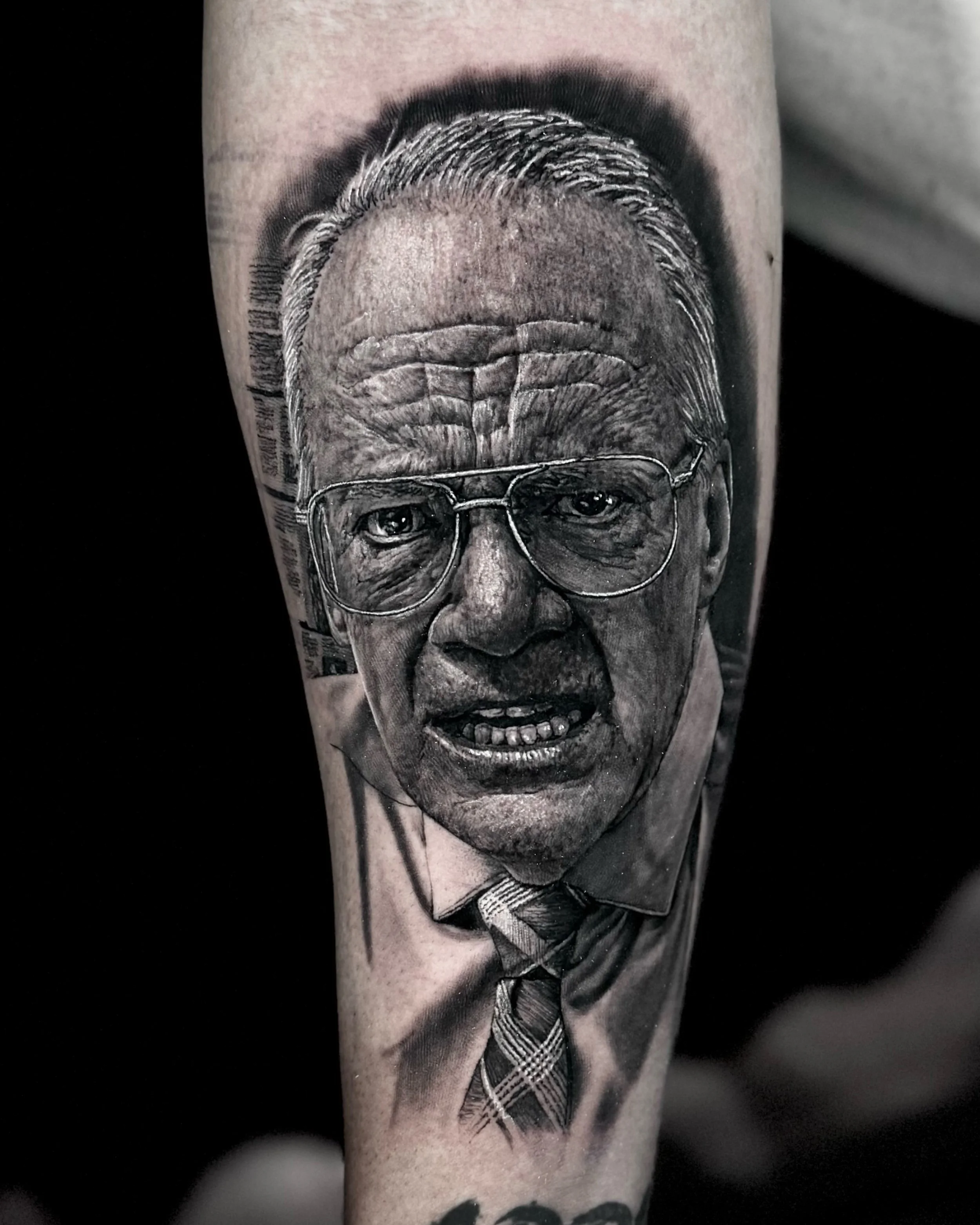 Elderly man with glasses portrait realism tattoo on the forearm by Etgar Oak