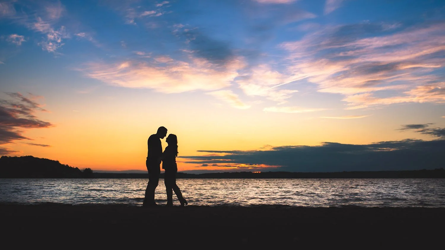 Bass Lake Beach sunset engagement photo near Orillia