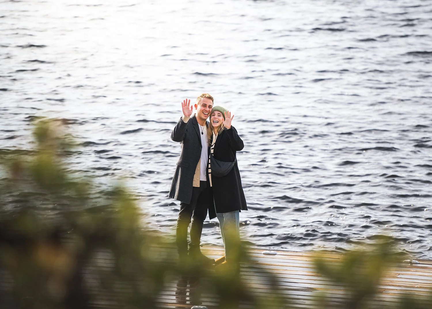 Photographer capturing  surprise proposal on a dock in Muskoka