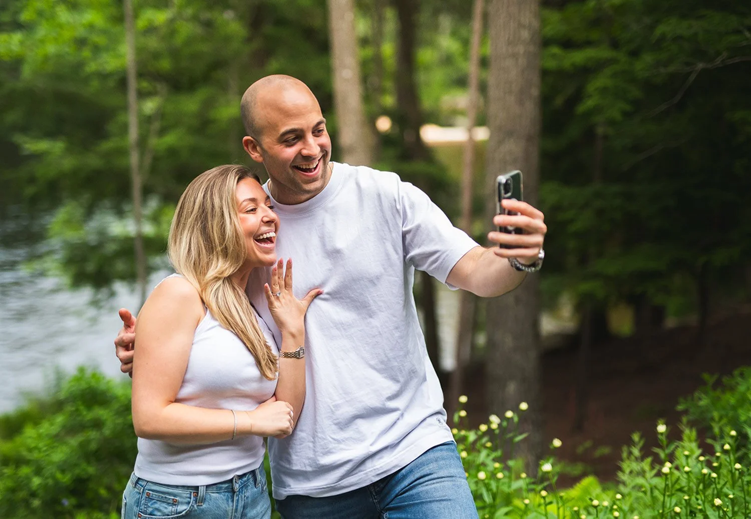 Newly engaged couple video calling their family to tell them the good news