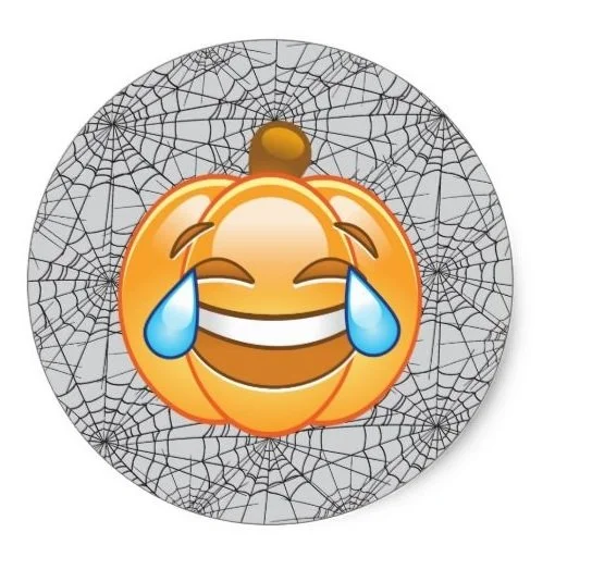 Pumpkin emoji with tears of joy on a spider web background.