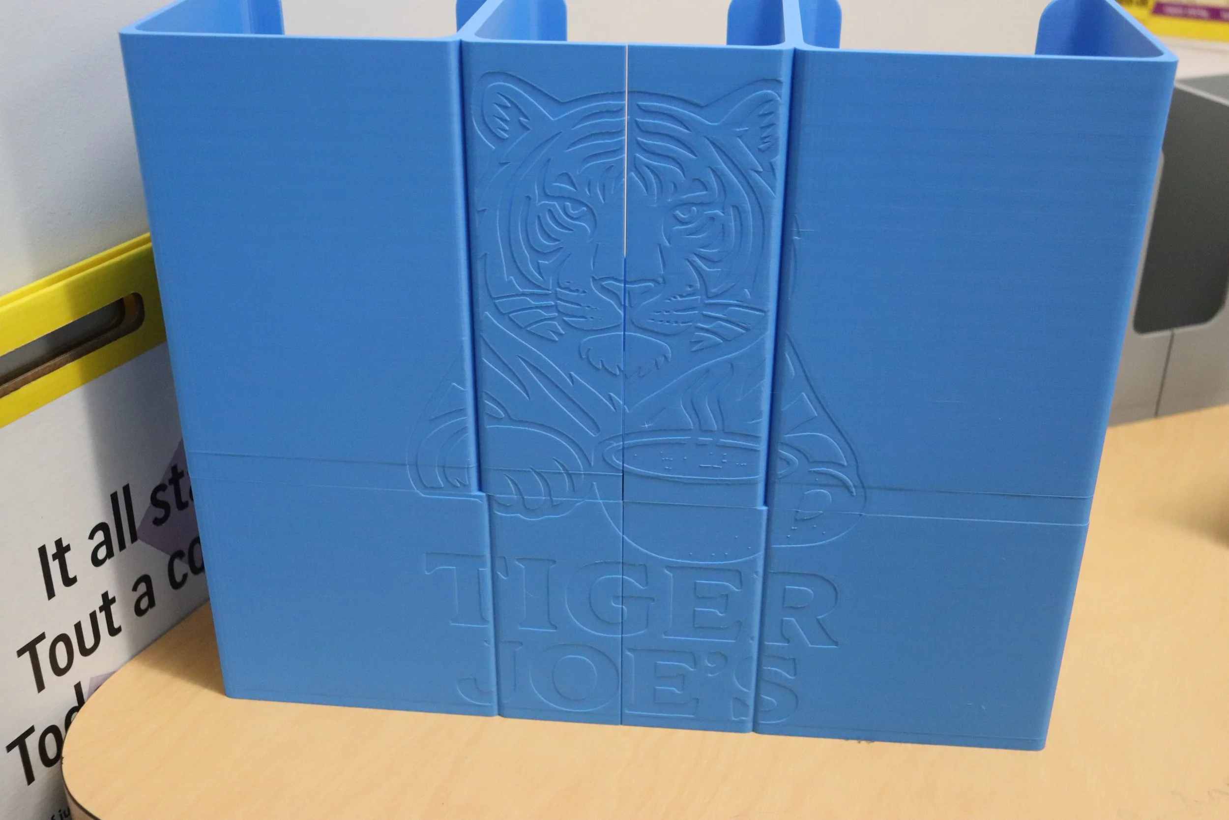 Other classes also got in on this project. Kristin Salazar’s graphic design class designed a logo that was printed onto the new Tiger Joe’s cup and lid holders using Bamboo Labs 3D filament. 
