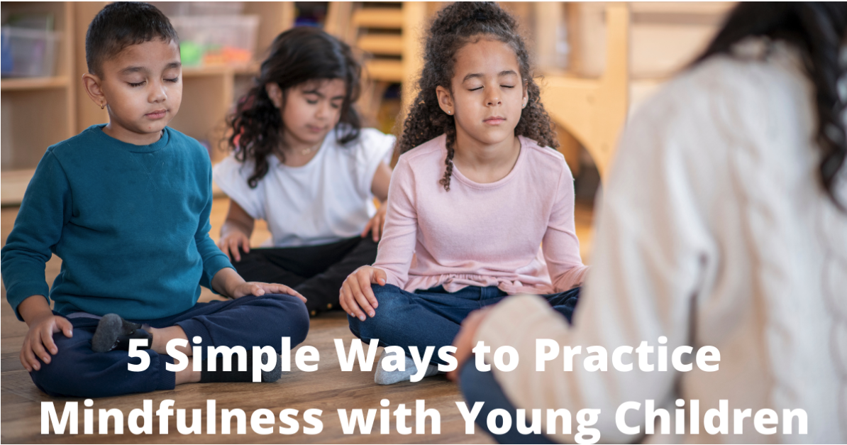 Children sitting cross-legged on the floor in a classroom have their eyes closed while listening to an instructor. Text title says, "5 Simple Ways to Practice Mindfulness with Young Children"