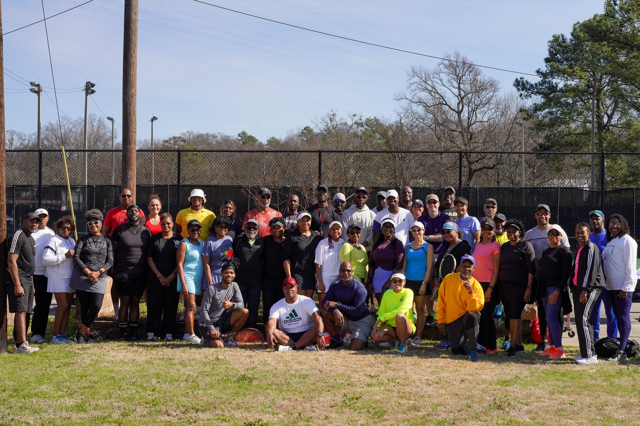 Group photo at James Lewis Tennis Center for Eugene Gilyard's Annual Mixed Doubles Tournament