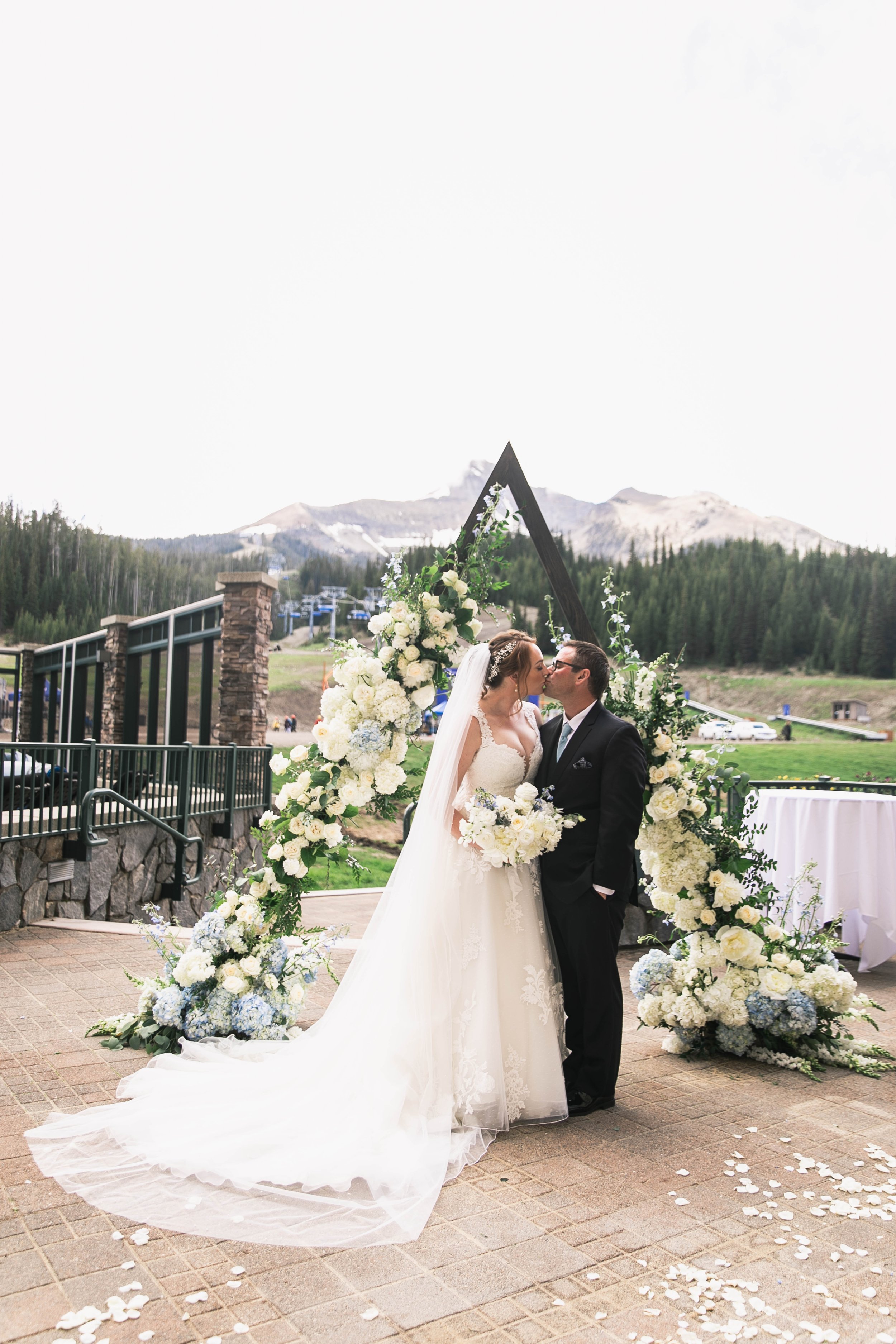 Big Sky Resort Wedding Ceremony triangle flower arch blue and white wedding flower ceremony