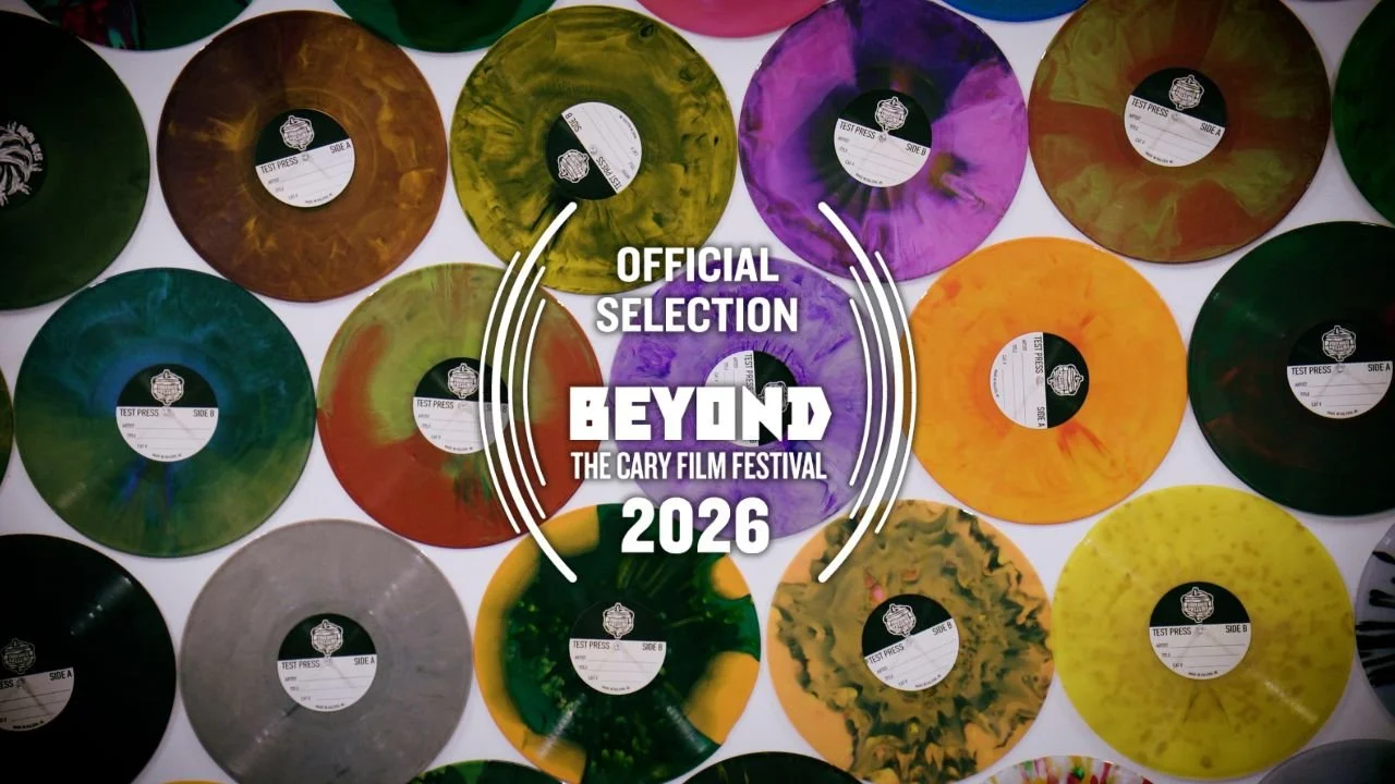 Colorful vinyl records arranged in rows with a centered overlay reading 'Official Selection Beyond the Cary Film Festival 2026.'