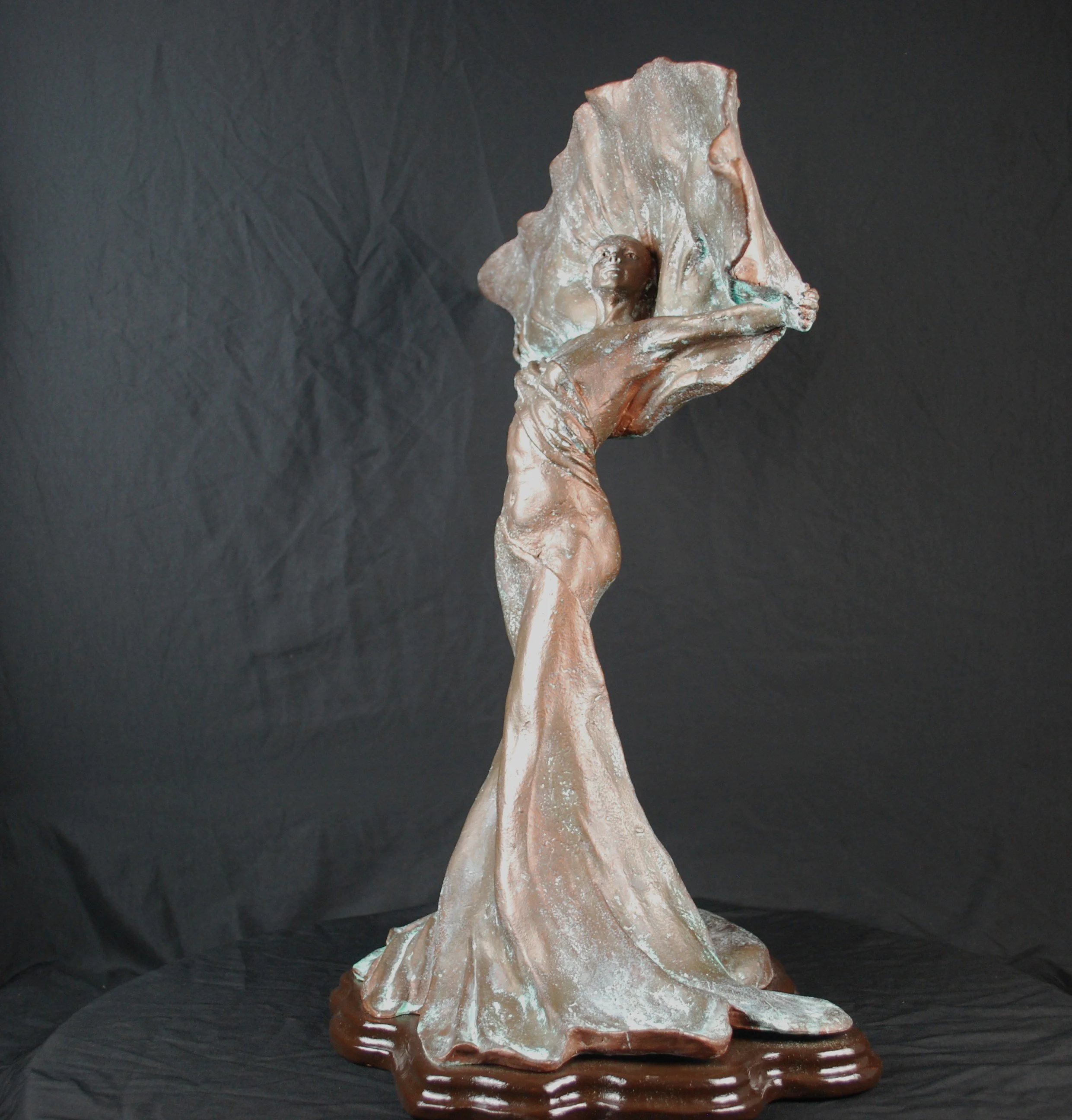 Flourish sculpture by Sharon Cruson, copper-infused figurative sculpture with sweeping fan-like form