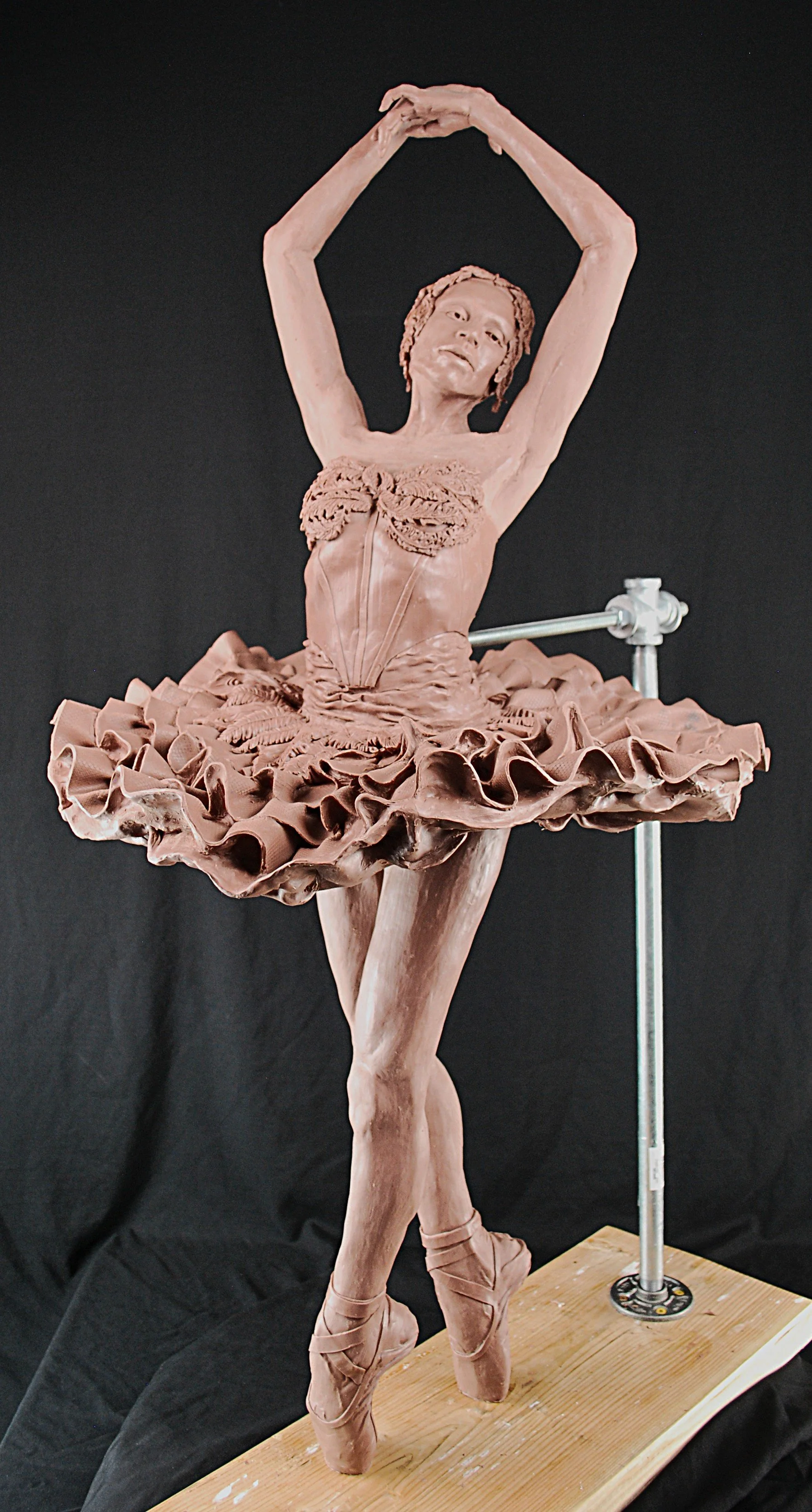Maria Tallchief figurative maquette by Sharon Cruson, ballerina en pointe with arms raised overhead