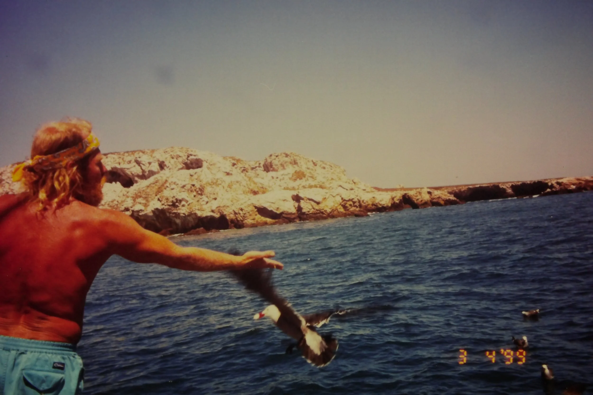 3.3.99 Dad feeding birds at Marietas.JPG