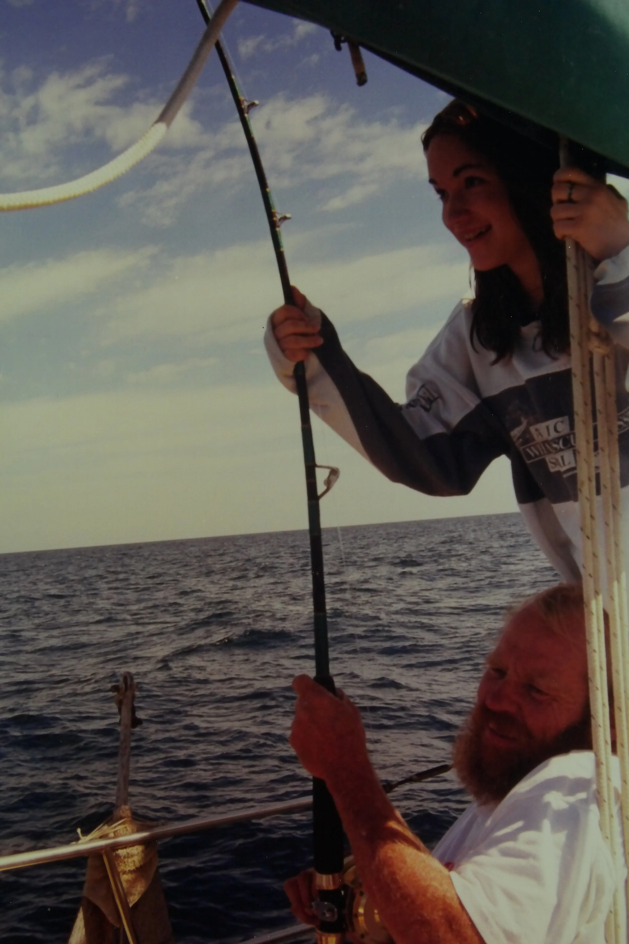  Me “helping” Dad reel in the tuna. 