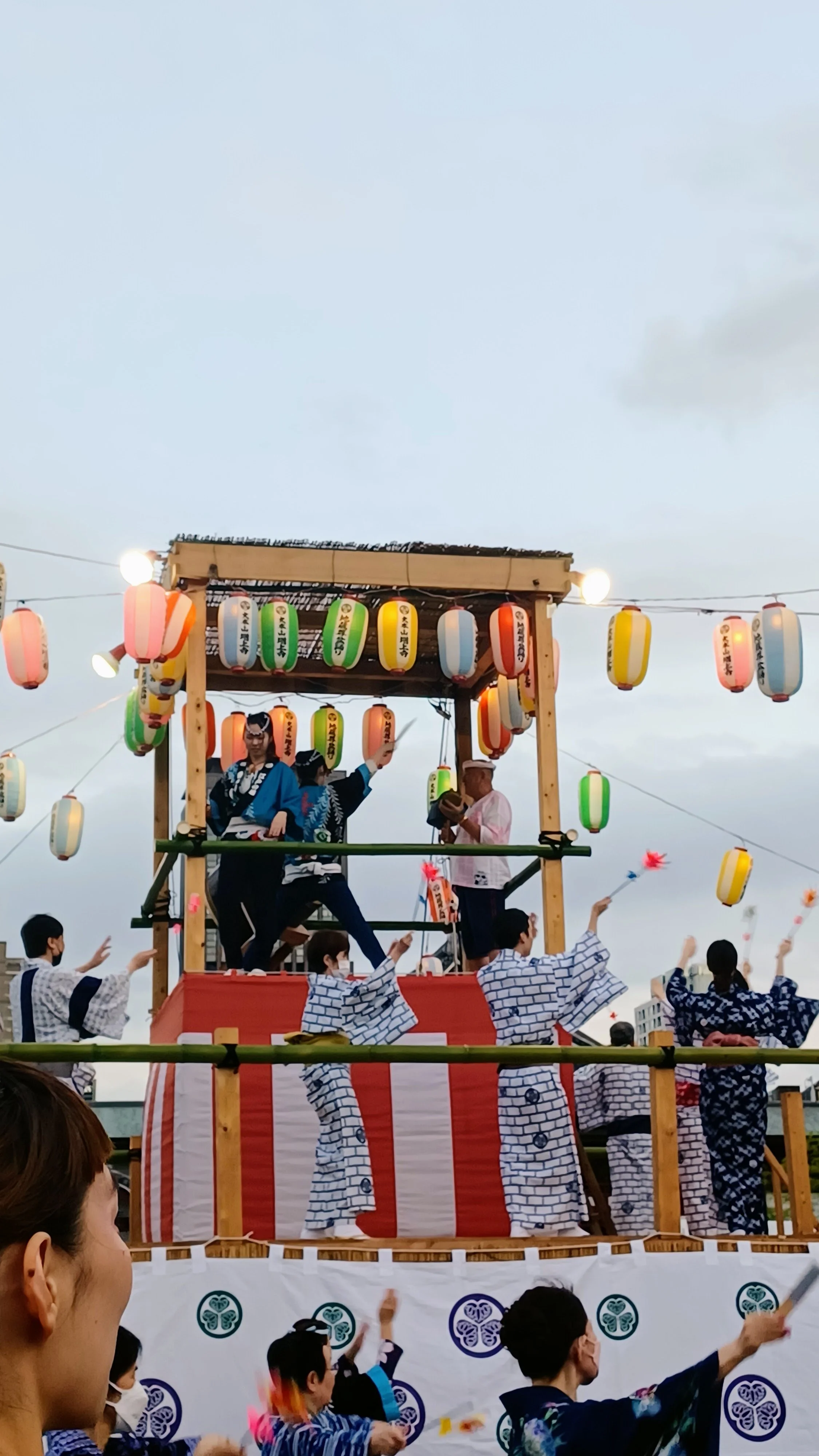 [The Boundless Circle of Bon Odori by Claire Shibatsuji] - This photograph captures a traditional Bon Odori festival in Japan. Beyond honoring ancestors, it creates a unique sense of belonging as strangers hold hands and share smiles in a shared circ
