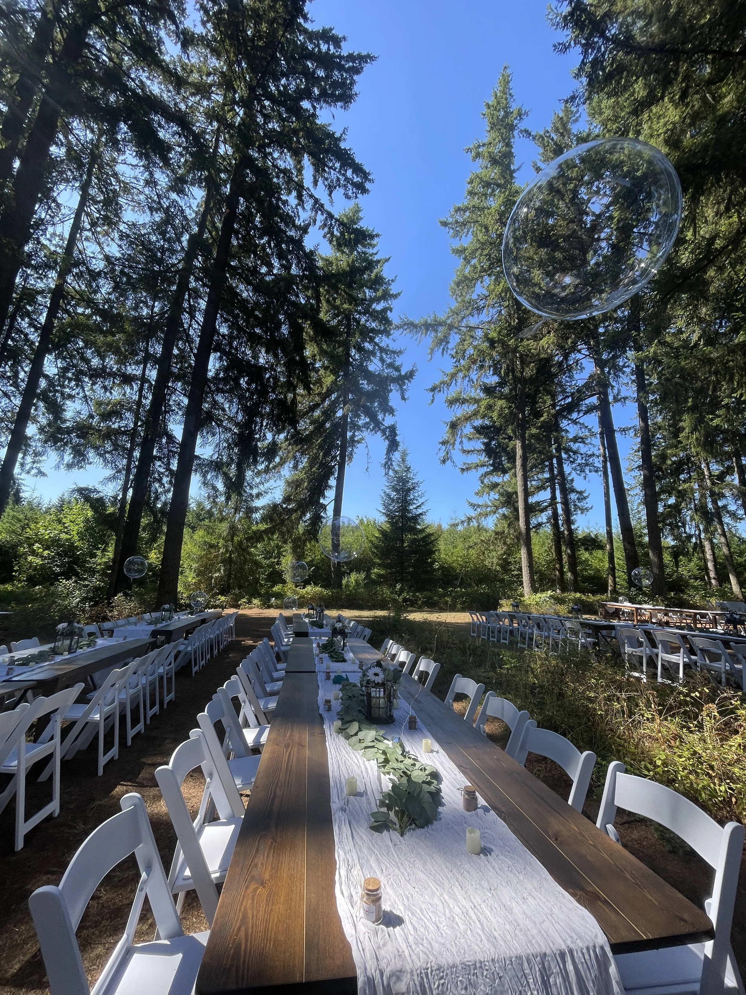 rustic farm tables and elegant white wooden chairs