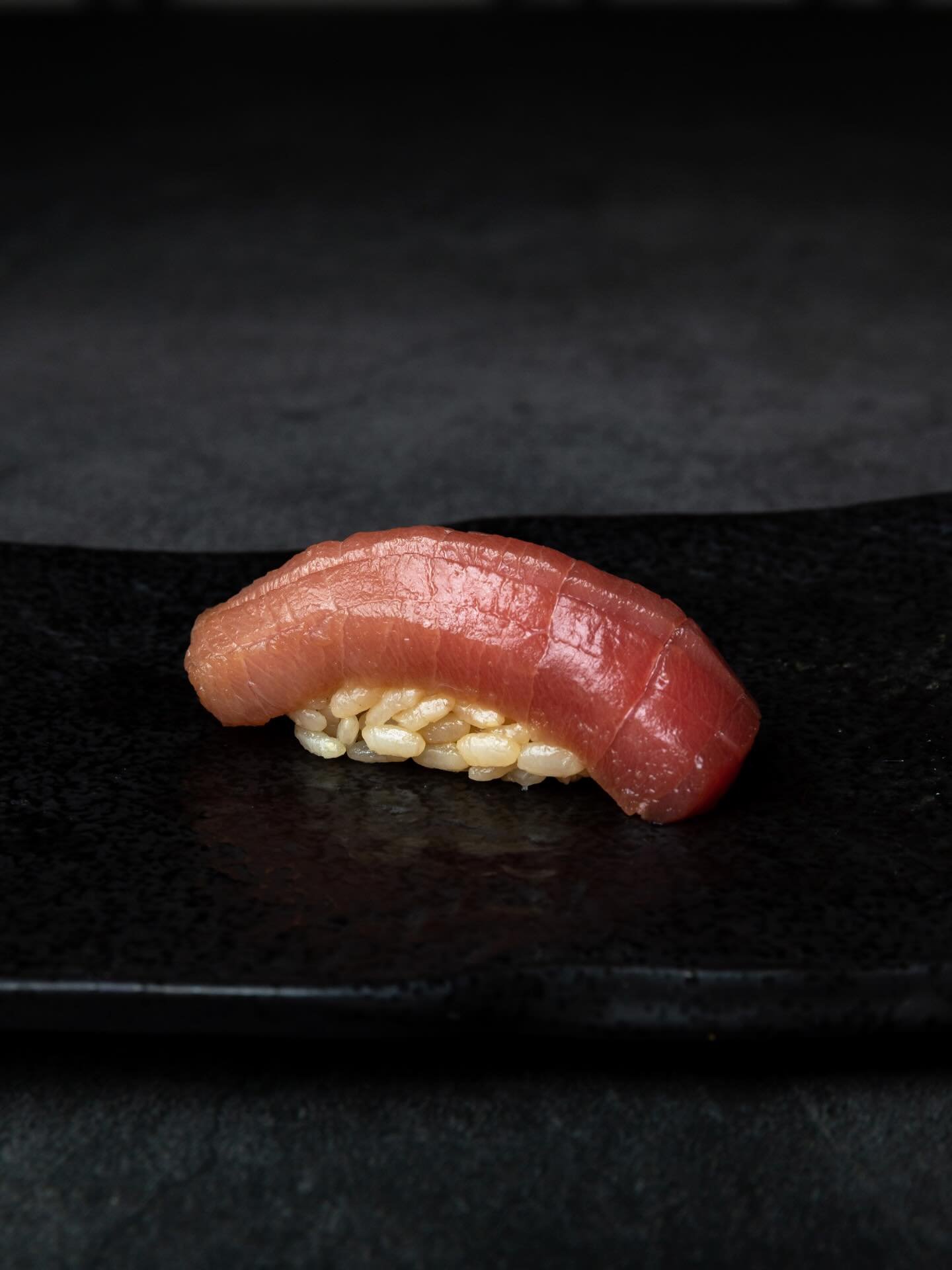 Nigiri looks simple.

Rice. Fish. Wasabi.

At Tetsu, simplicity is where the work begins.

The rice is seasoned and formed by hand while still warm.
The fish is sliced with attention to grain and fat.
Each piece is shaped so it holds together, yet yi