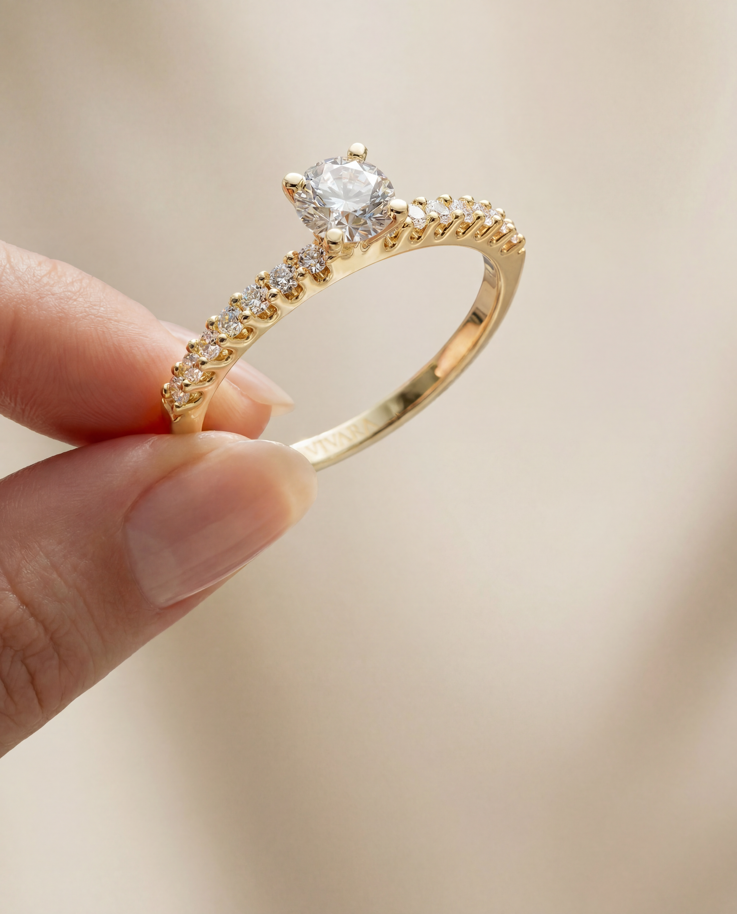 Vivara-Engagement ring between fingers.png