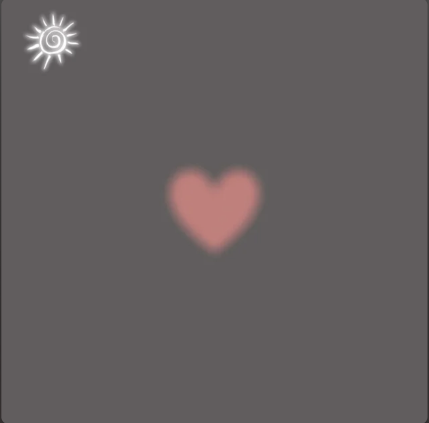 A blurred image with a pink heart in the center and a sun symbol in the top left corner against a gray background.