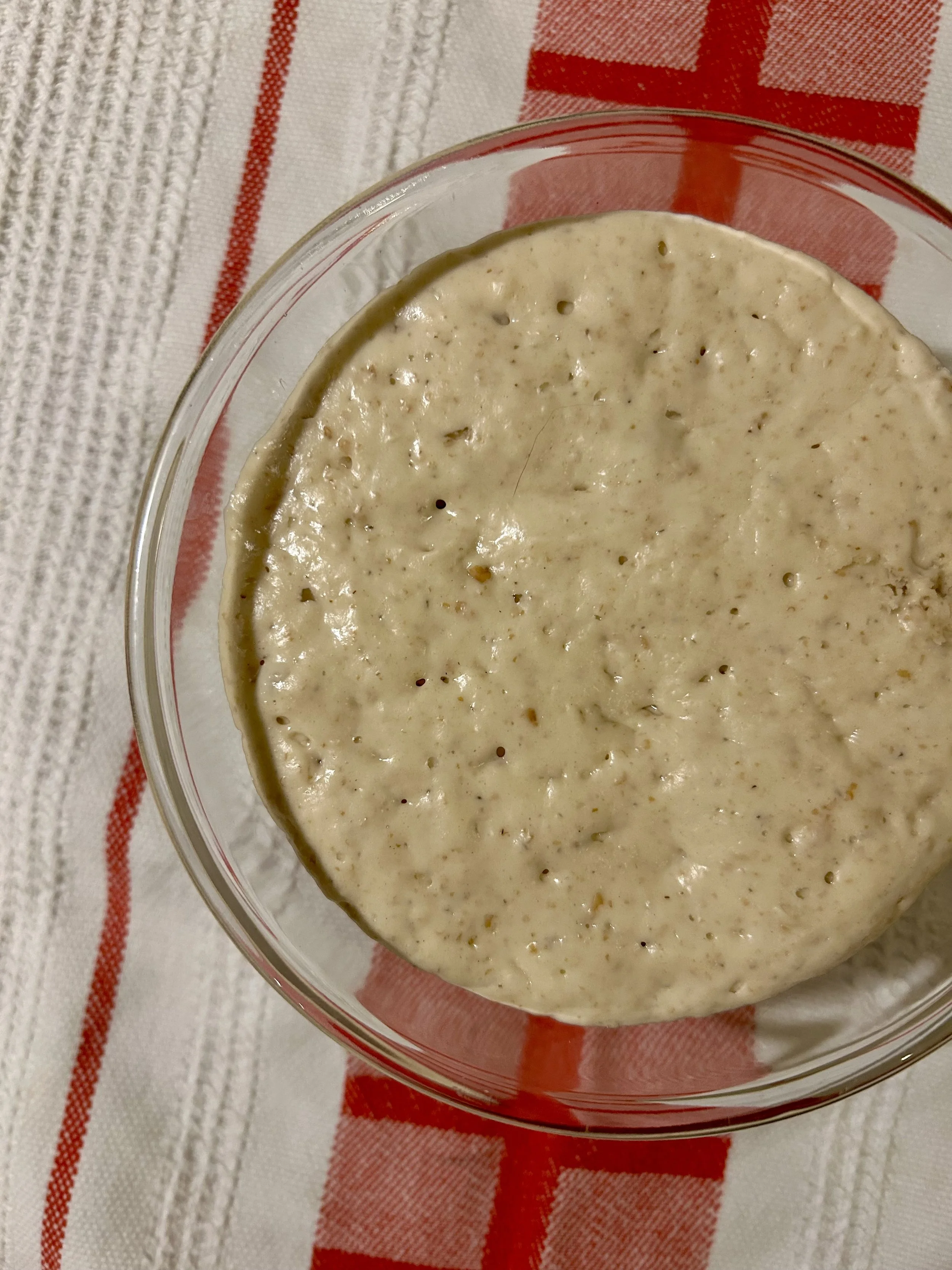 A close-up of sourdough starter - aka levain - in a bowl.!