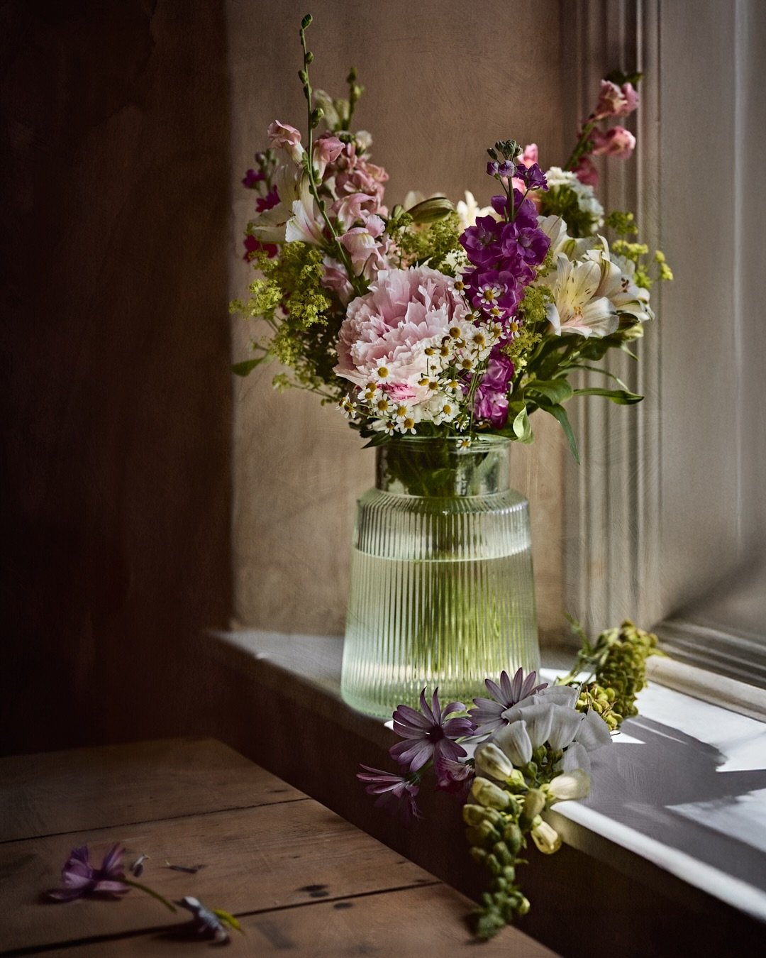 Fresh from the garden, cradled by morning light &mdash; each petal a whisper of this new chapter. In the quiet hush of my Dorset cottage, I was gifted these wild-soft stems with soil still clinging, their scent wrapping the room in stories of summer 