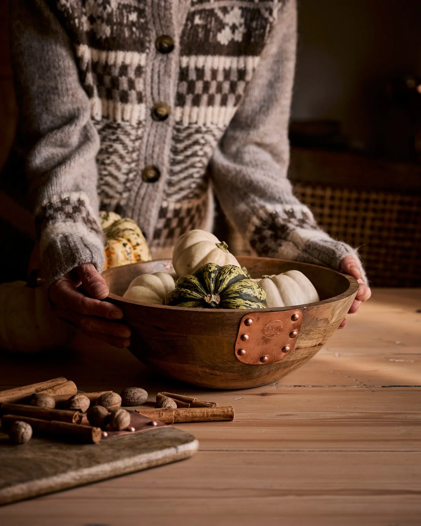 Cradled in warm knits and copper-kissed wood, the harvest whispers its quiet song. Tiny gourds like love notes from the earth, cinnamon and nutmeg strewn like memories on the table &mdash; this is the season where hearts slow, hands warm, and everyth