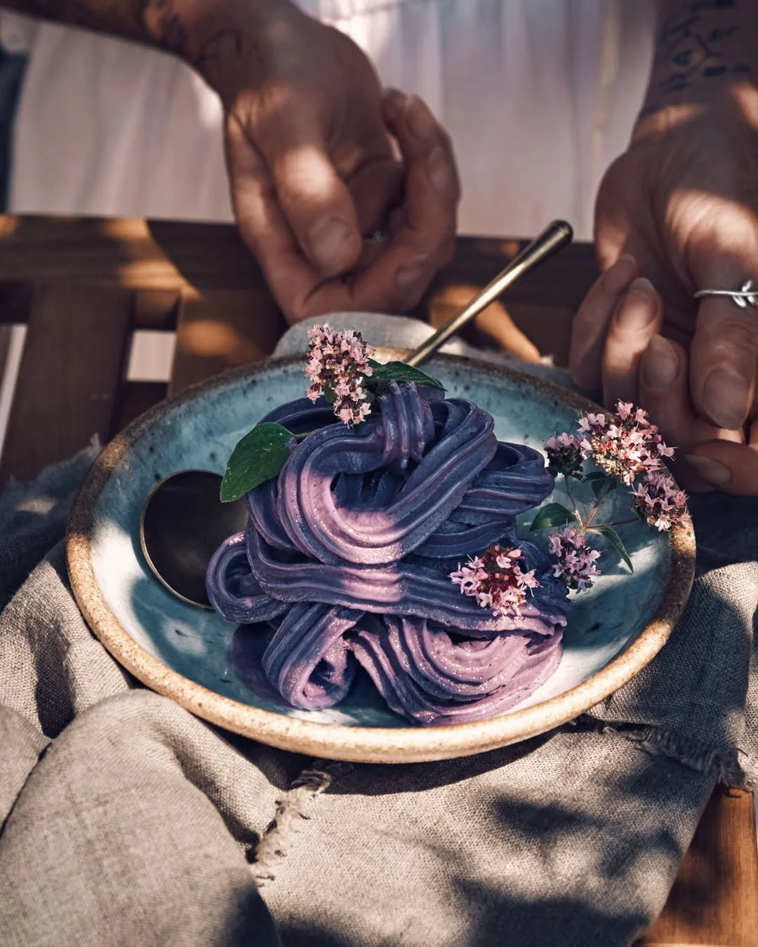 macro image of purple swirled ice  cream in dappled summer light