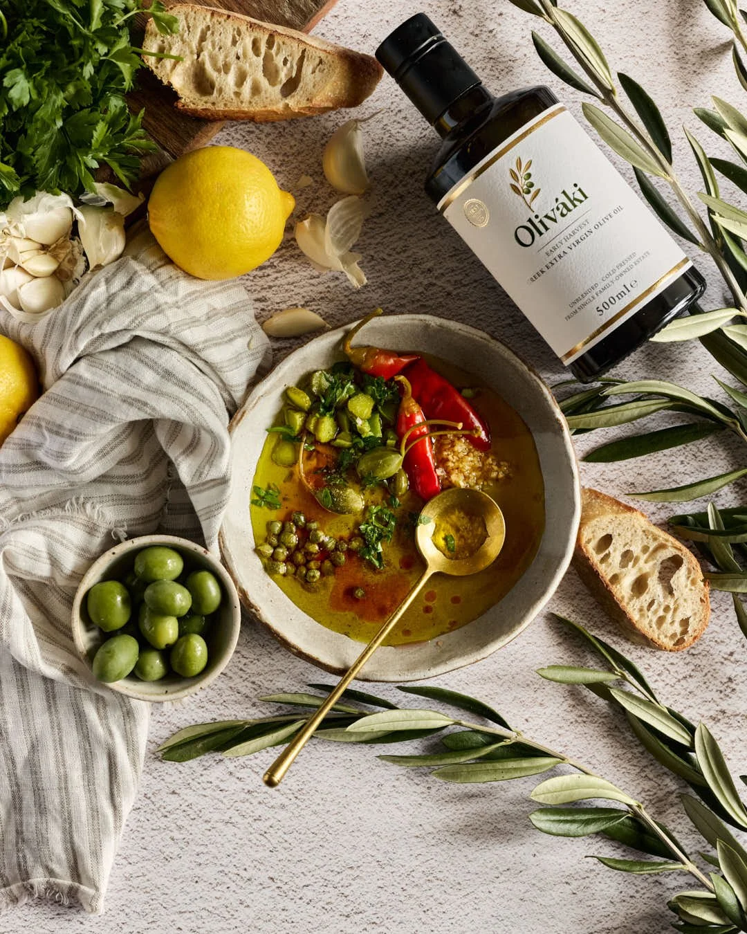 flatlay image of olive oil dipping bowl in greek style scene
