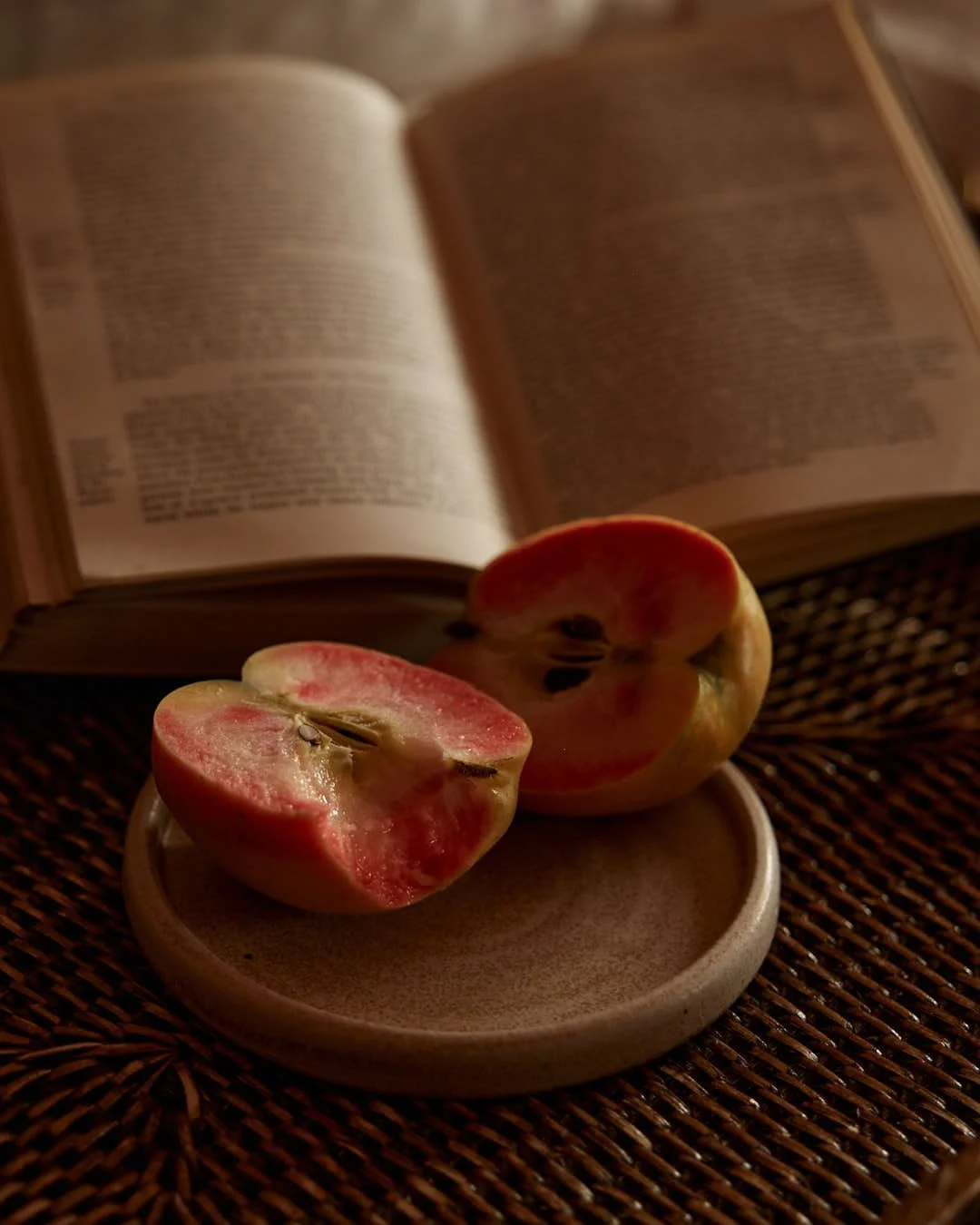 angled image of apple with bite removed