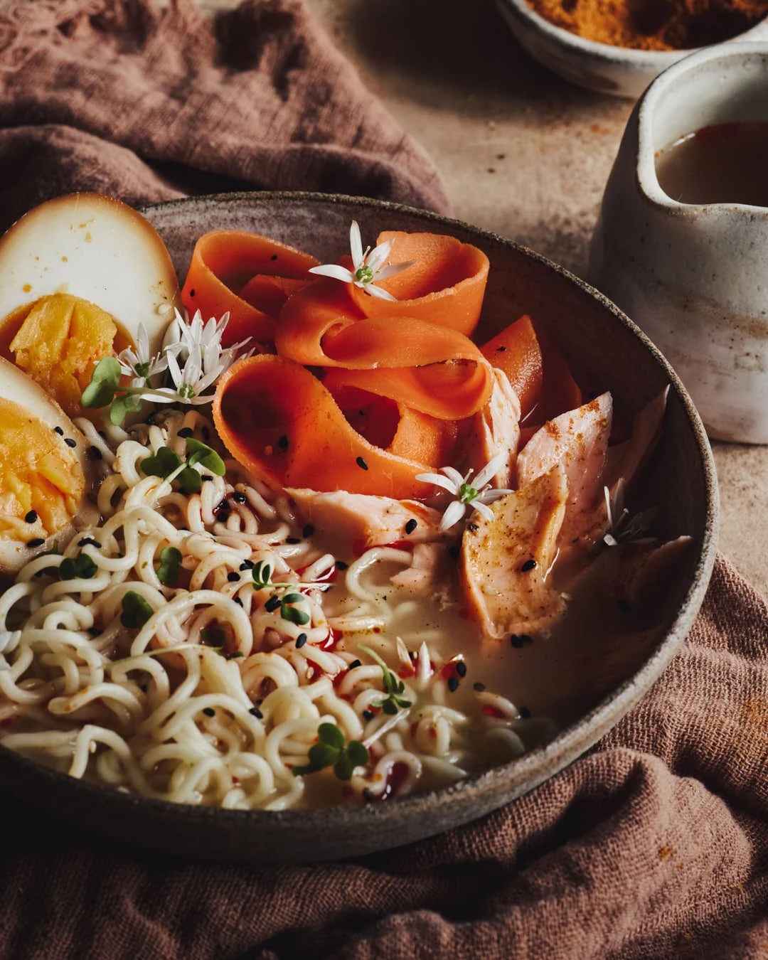 latlay image of ramen noodles with eggs in rustic scene