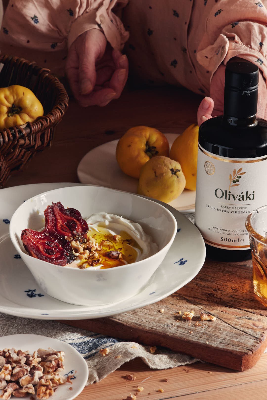 angled image of sticky quince yogurt bowl in stunning light with girl to back