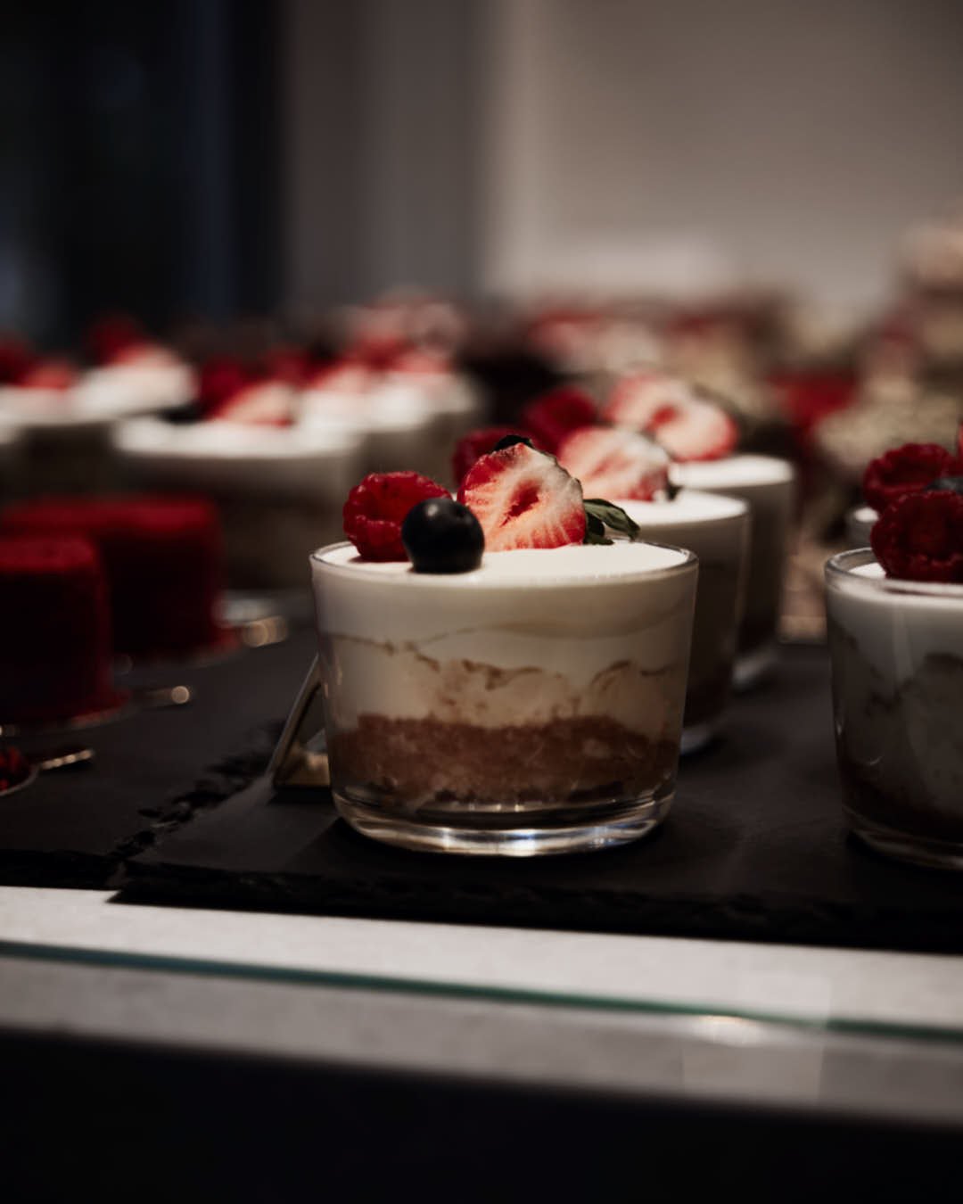 cheesecake in pot in store scene with berry garnish