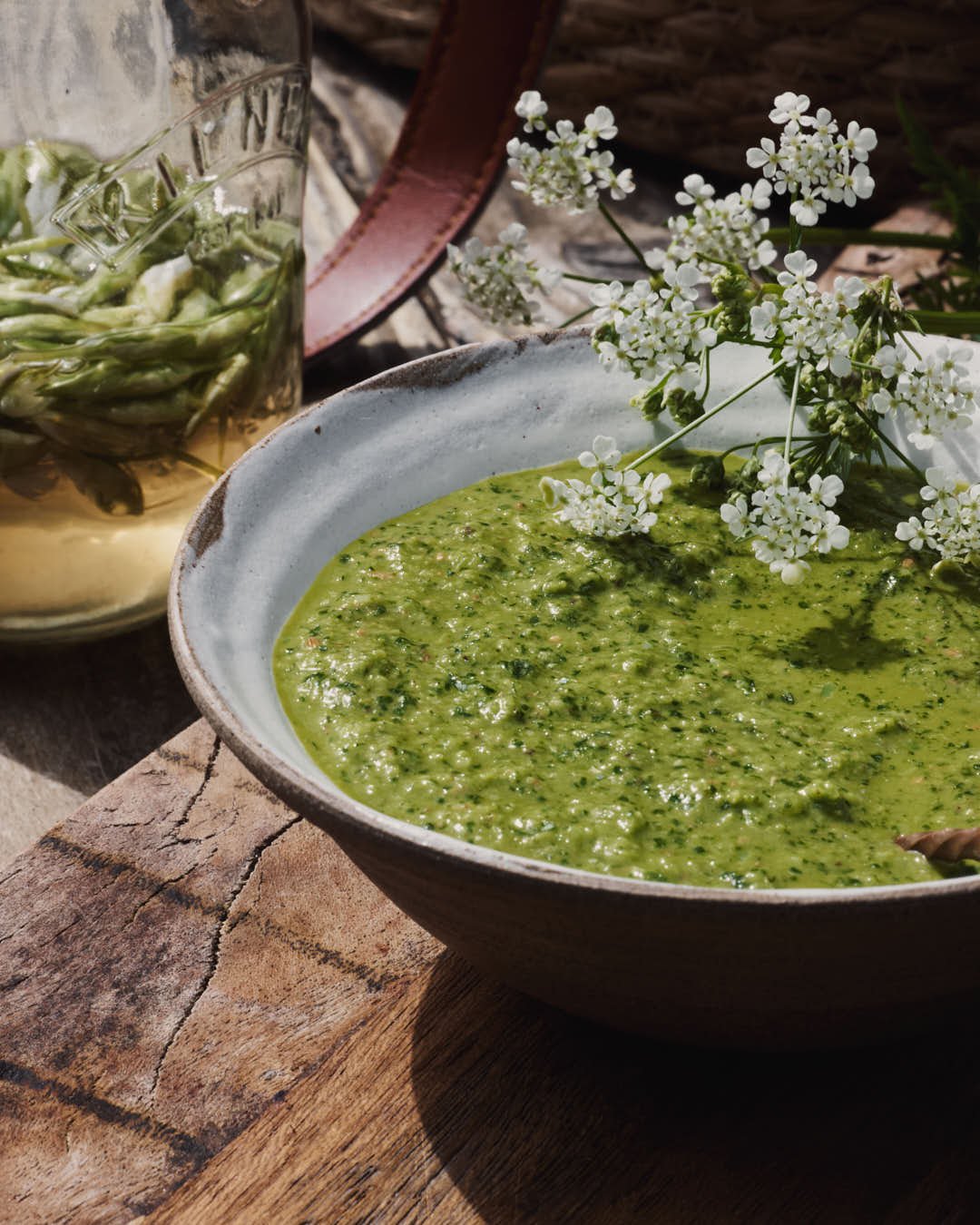 macro image of nettle sauce with cows parsley flowers