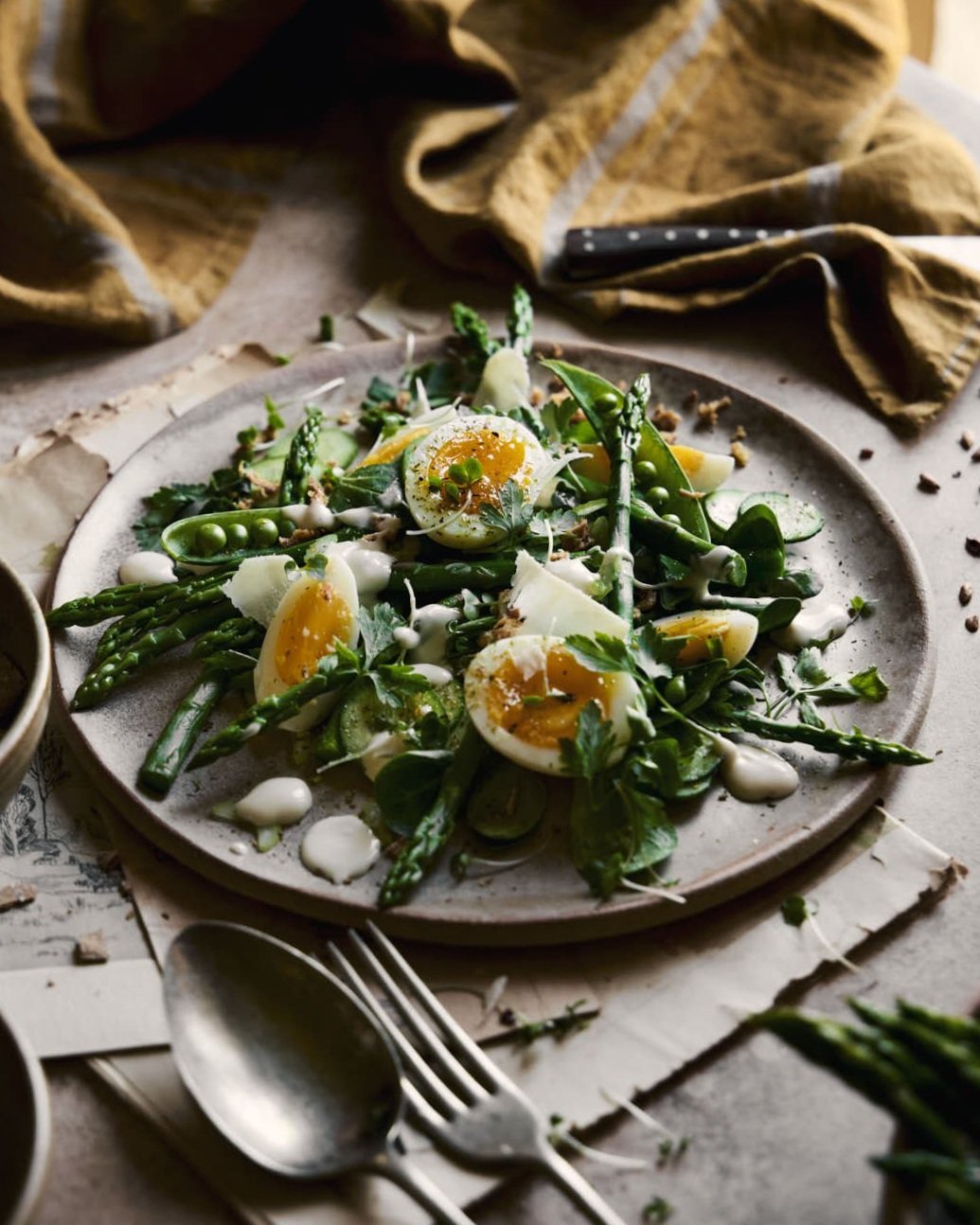 bantam caesar sald on rustic plate in moody scene on kitchen table